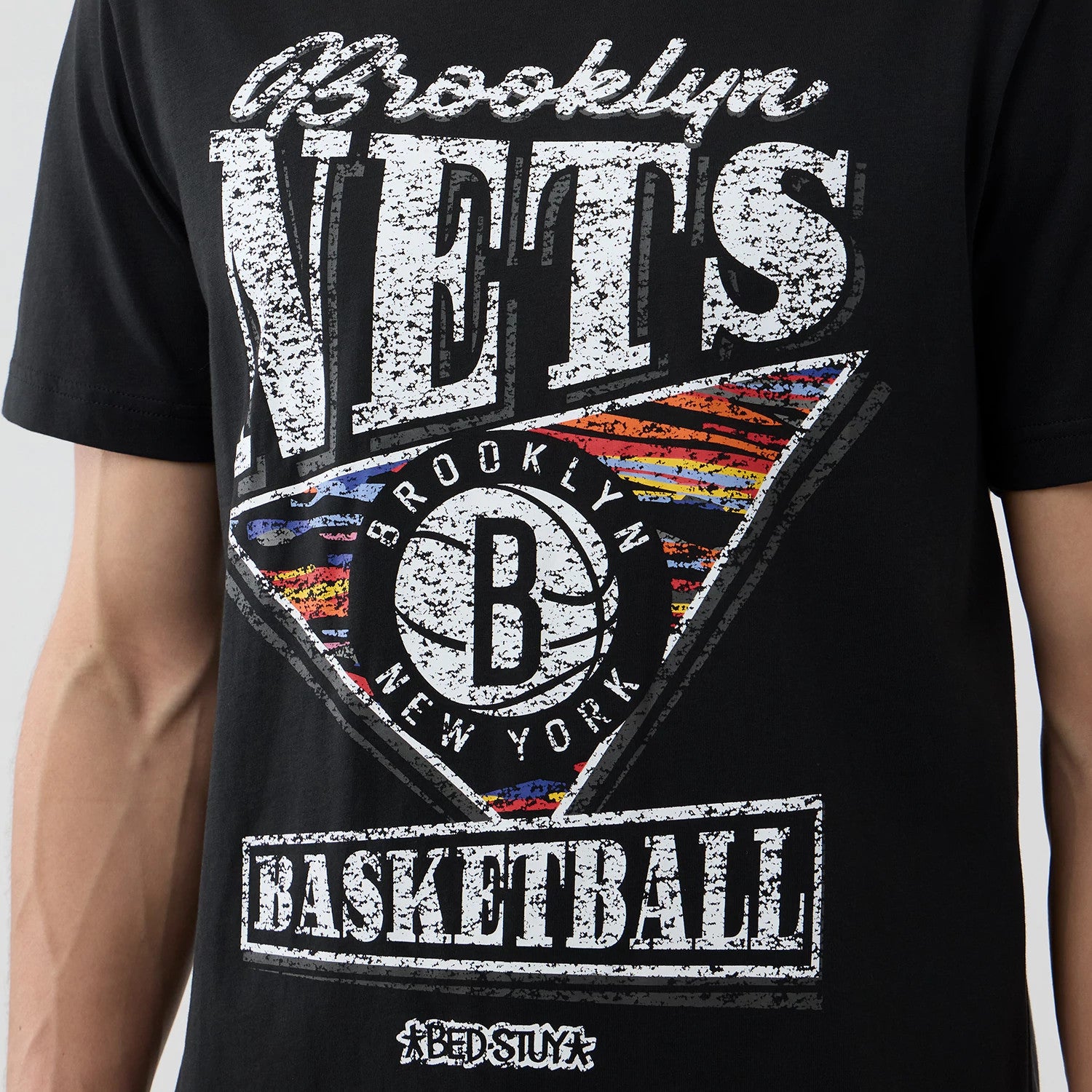 The Male model is wearing Brooklyn Nets NBA City Edition Black T-Shirt 4