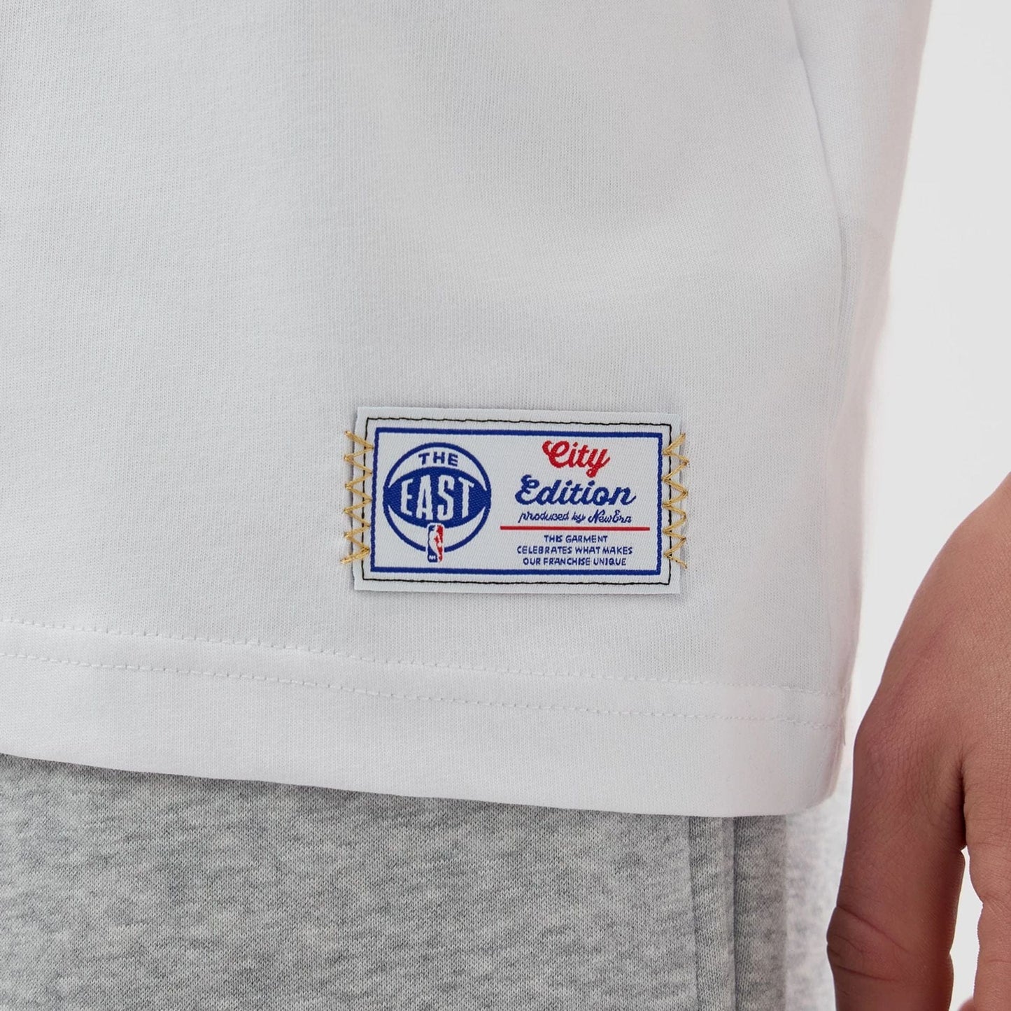 The Male model is wearing Boston Celtics NBA City Edition White T-Shirt 4