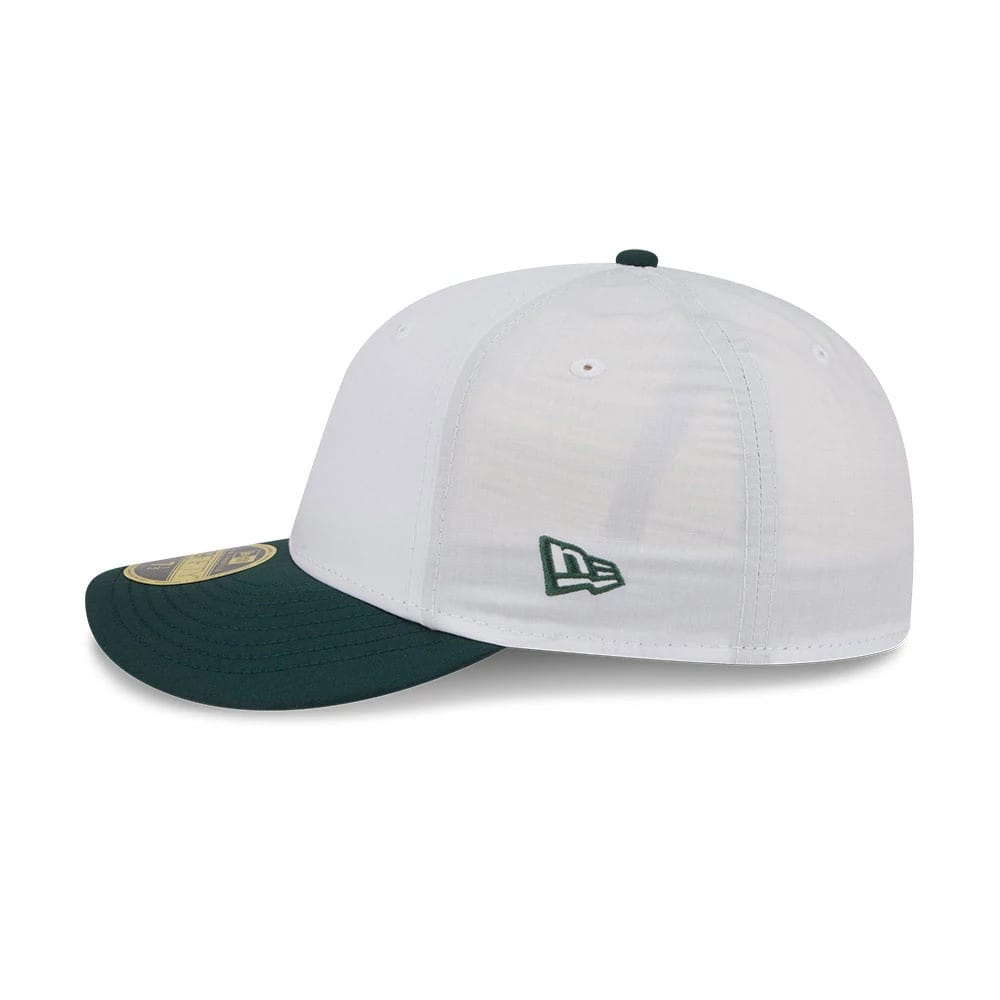 New Era Open White & Dark Green Low Profile 59FIFTY Fitted Cap, side view showing the green embroidered New Era flag logo on the left side of the structured white crown and a dark green curved visor with a gold 59FIFTY size sticker.