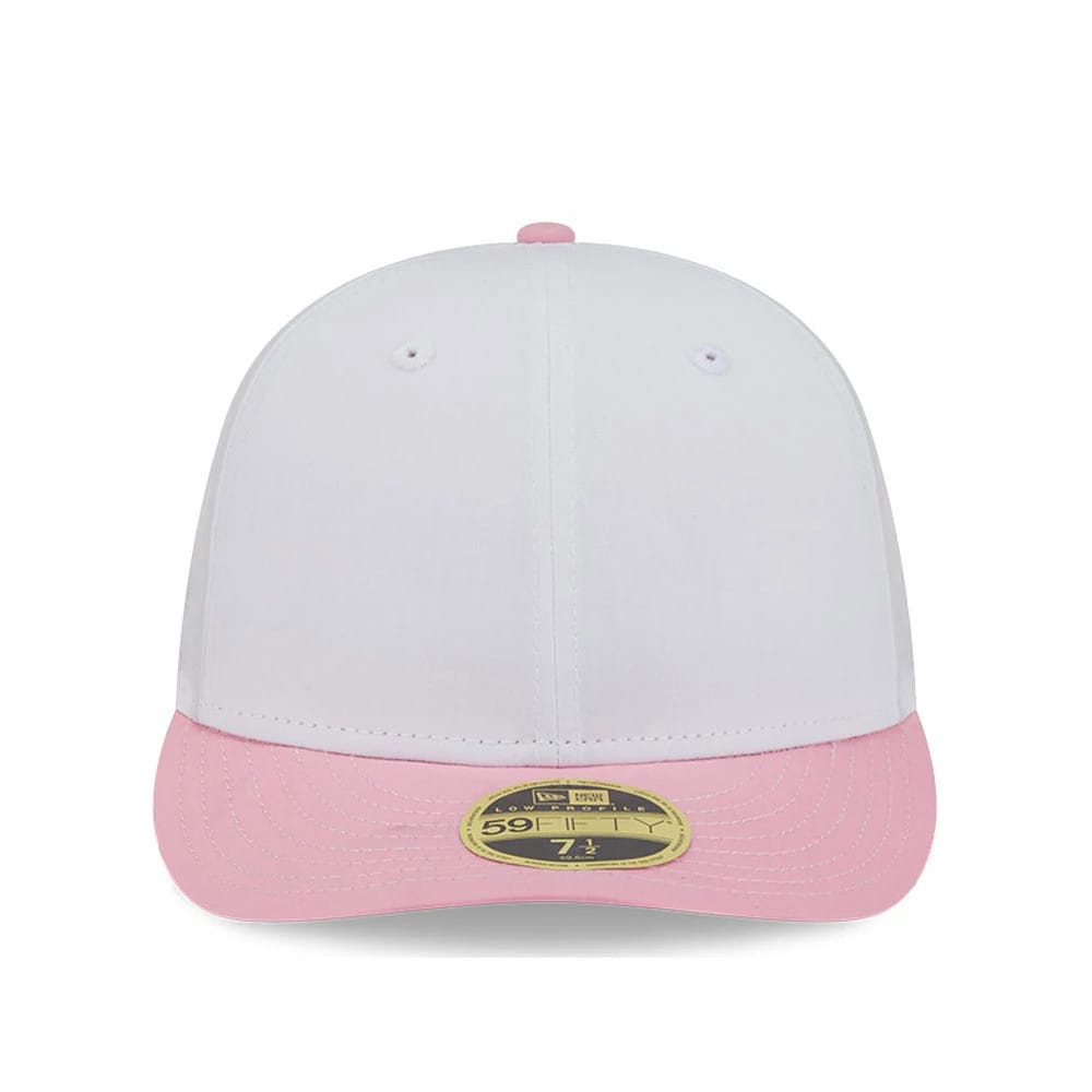 New Era Open White & Pink Low Profile 59FIFTY Fitted Cap, front view showing a clean white crown with matching eyelets and a top button, a pink visor with a gold 59FIFTY size sticker and a white undervisor hint.