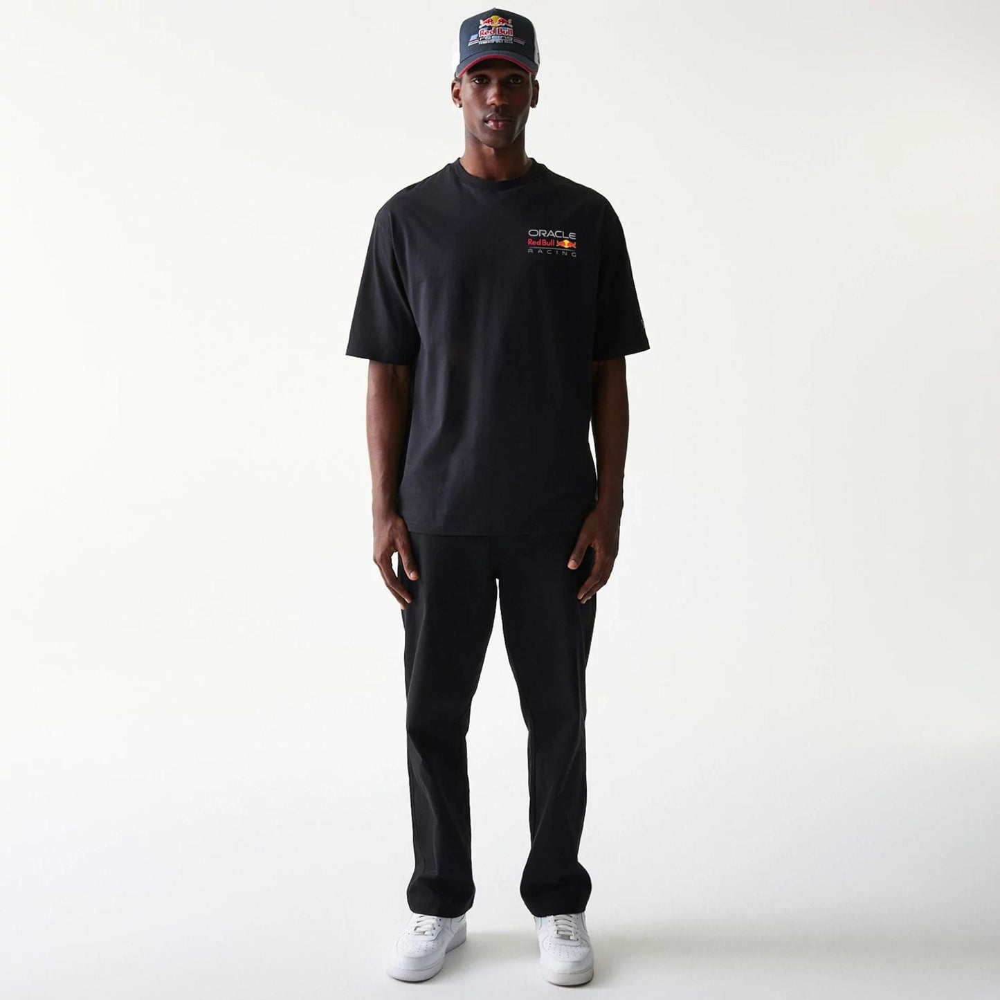 The Male model is wearing Red Bull Racing Black Oversized T-Shirt 8