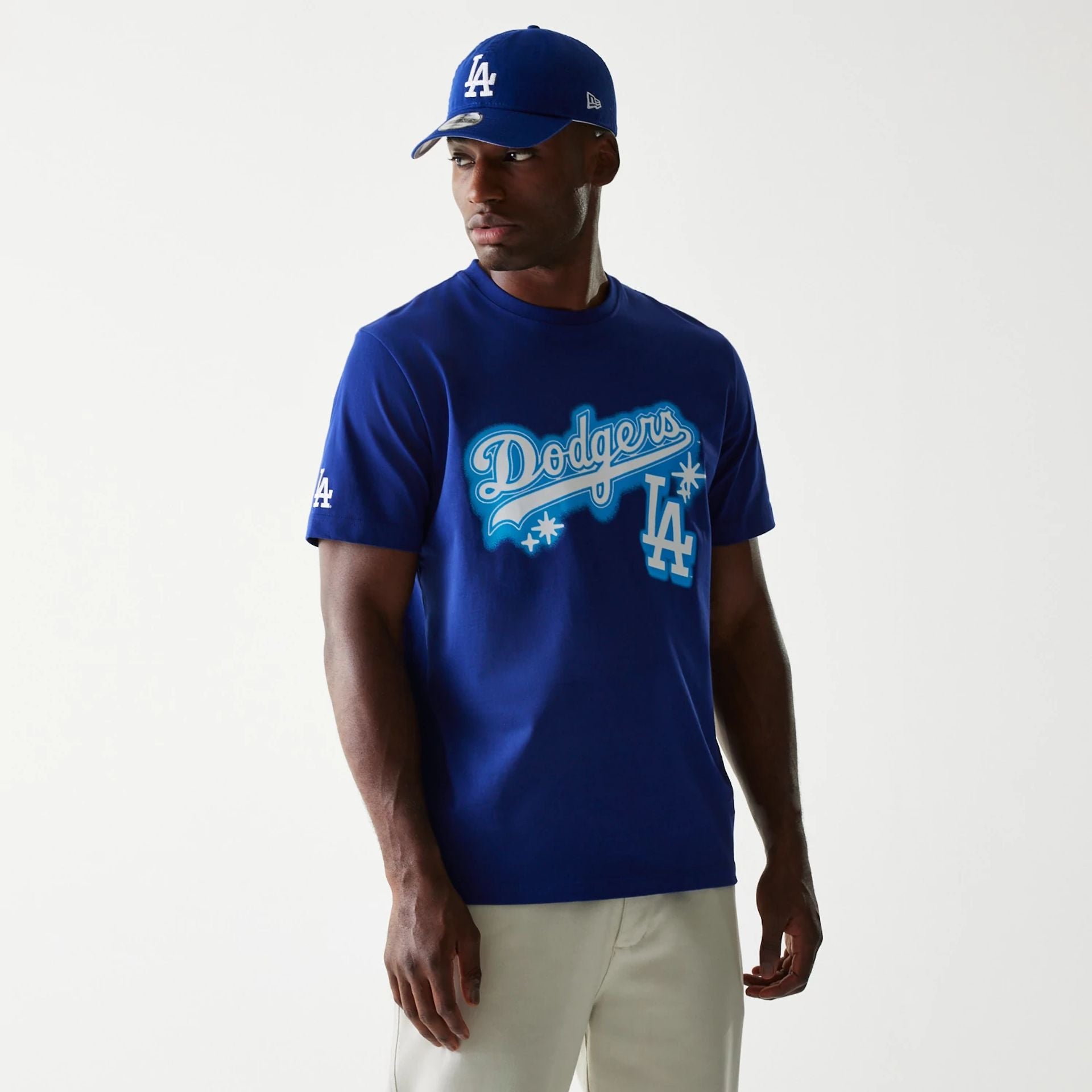 The Male model is wearing LA Dodgers OVO x MLB Dark Blue T-Shirt 1