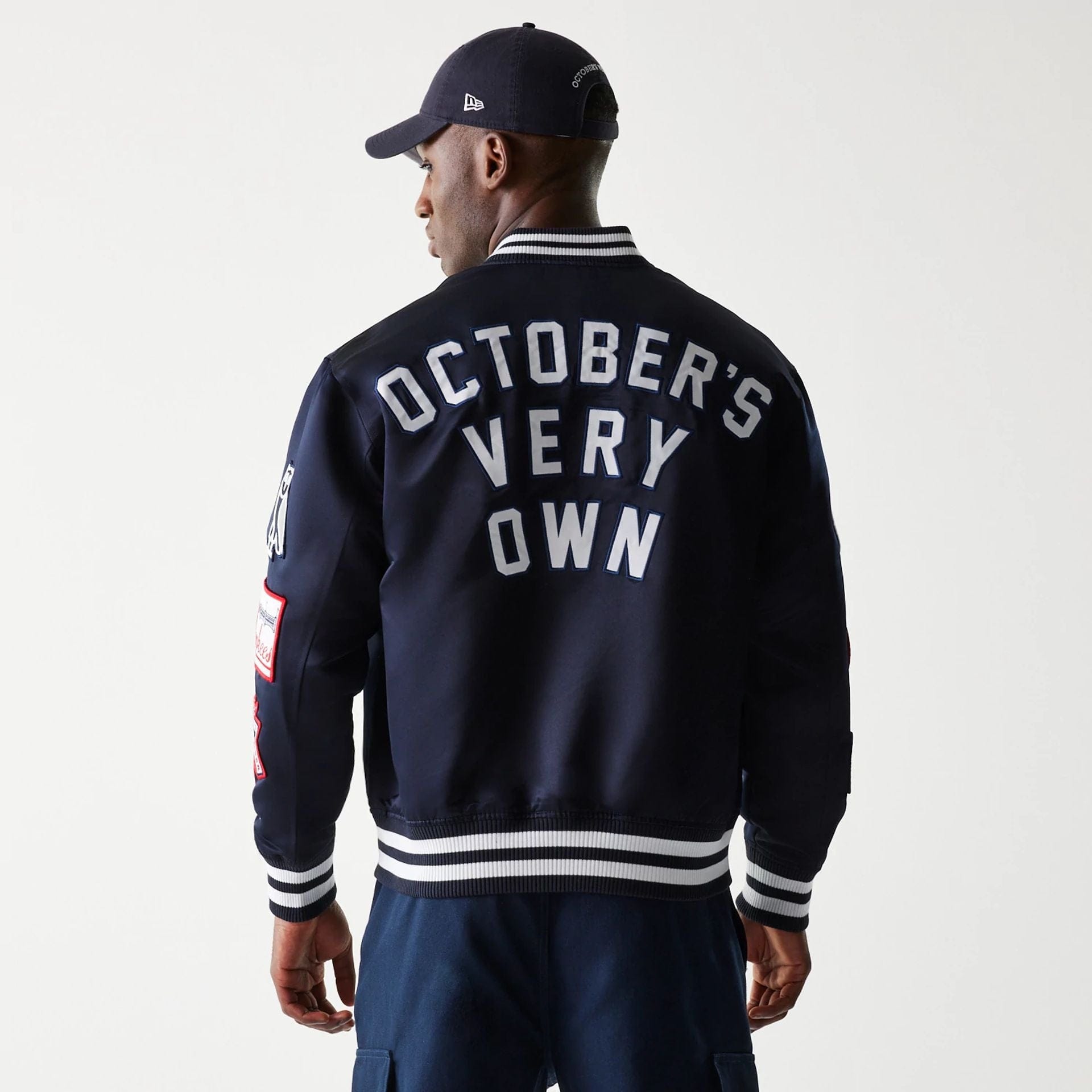 The Male model is wearing New York Yankees OVO x MLB Navy Jacket 2
