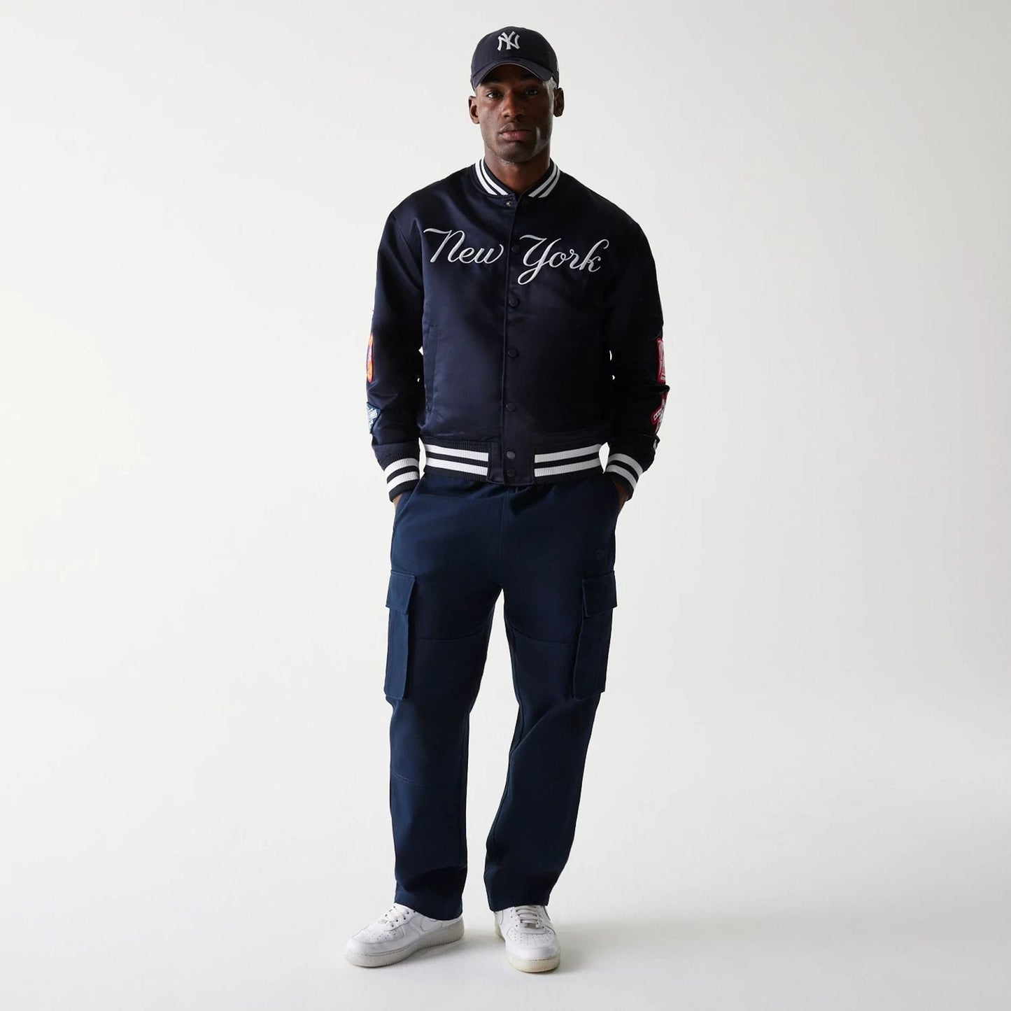 The Male model is wearing New York Yankees OVO x MLB Navy Jacket 8
