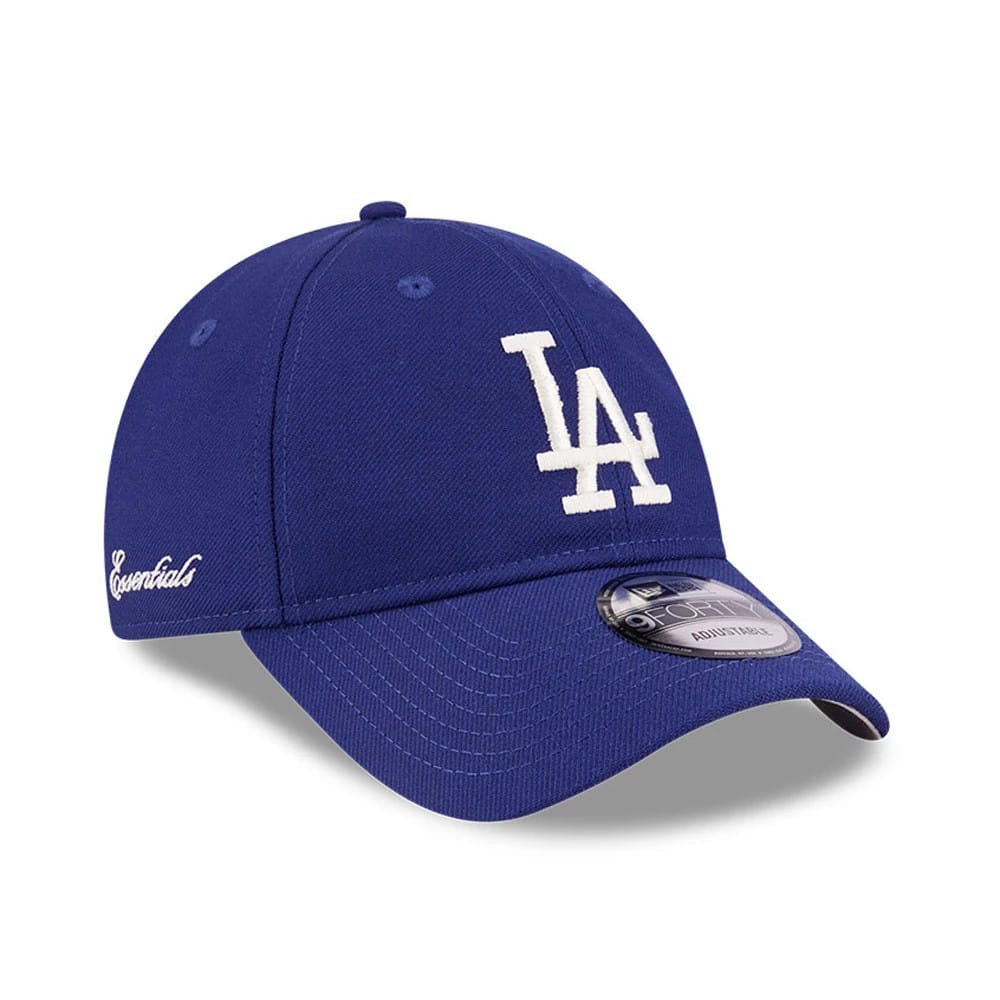 LA Dodgers FOG X MLB Dark Blue New Era 9FORTY Adjustable Cap, front view showing the white embroidered LA logo on the structured crown, dark blue curved visor with a 9FORTY size sticker, and Essentials script on the left side.