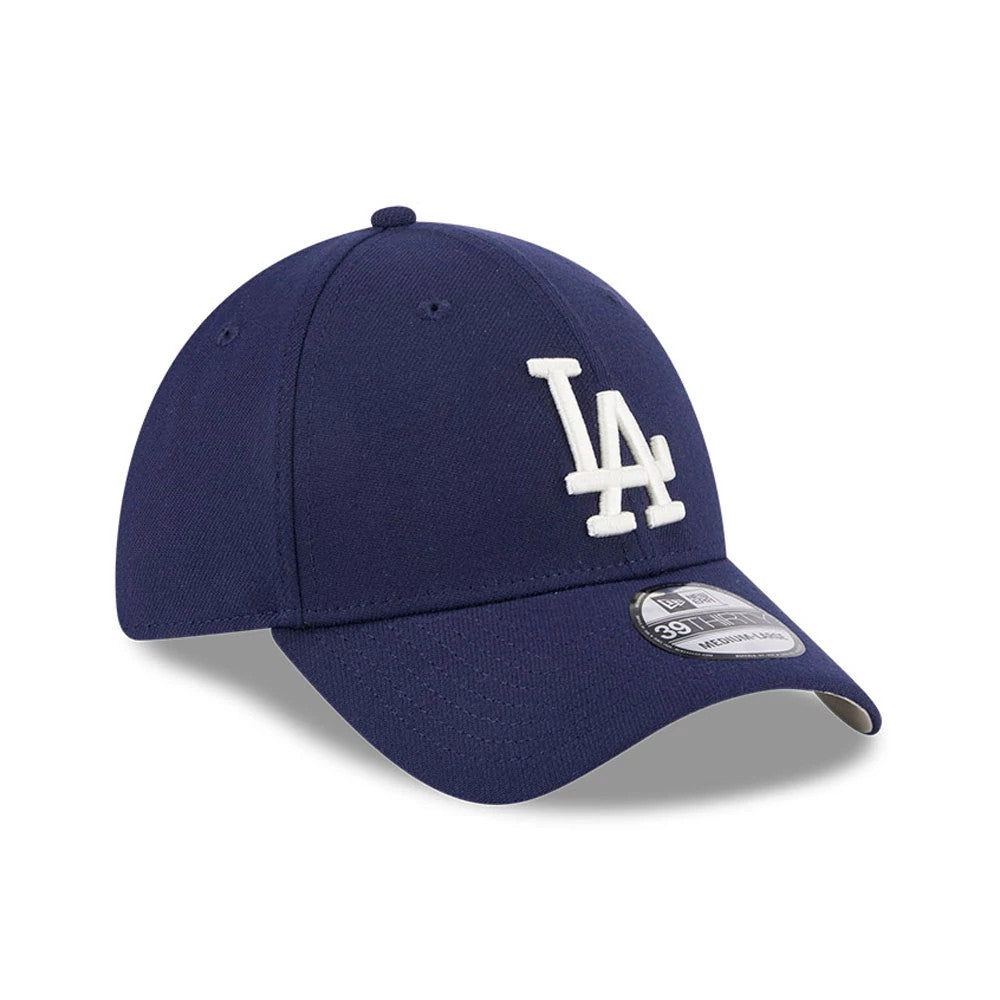 LA Dodgers MLB Lifestyle Navy New Era 39THIRTY Stretch Fit Cap, three-quarter view showing the white raised embroidered LA logo on the front panel, curved navy visor, and 39THIRTY size sticker on the visor.