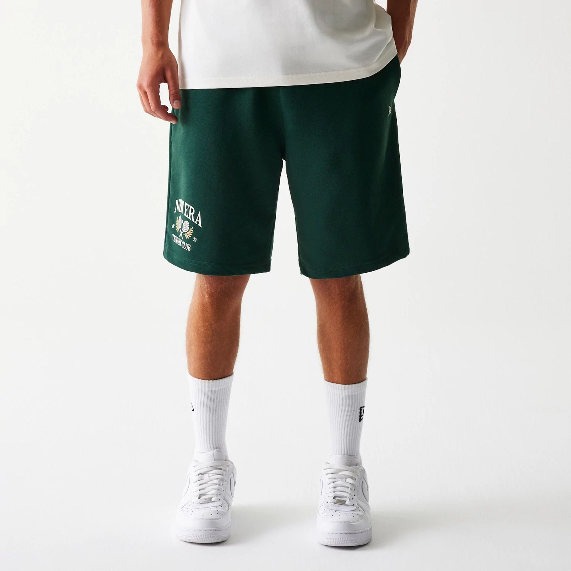 The Male model is wearing New Era Front Logo Dark Green Shorts 1