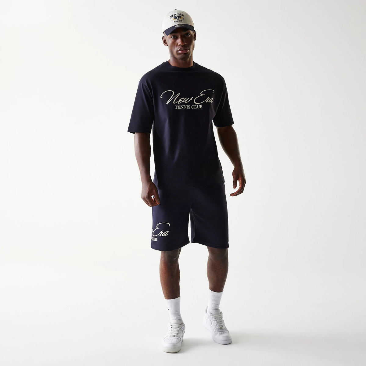 The Male model is wearing New Era Side Logo Navy Shorts 8