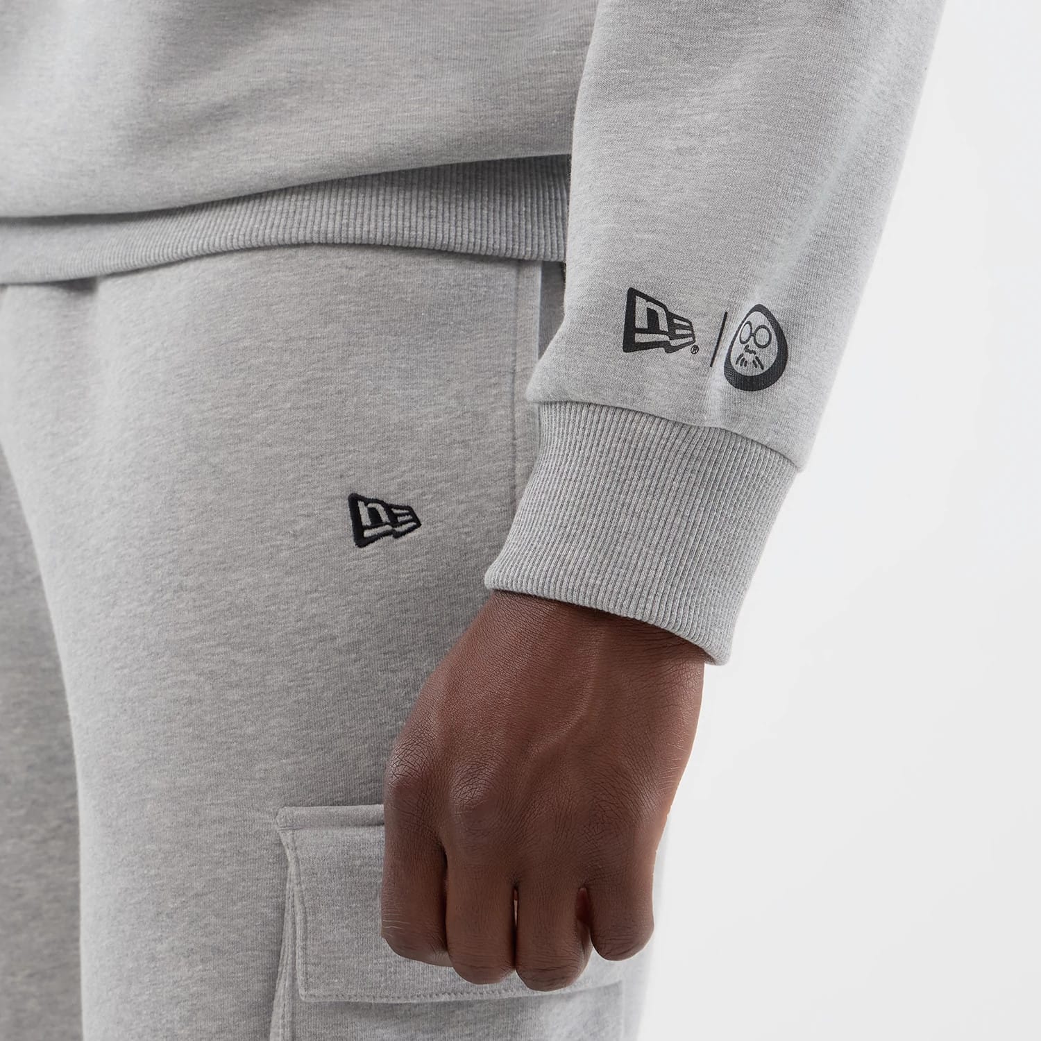 The Male model is wearing Sakamoto Days Netflix Grey Crew Neck Sweater 4