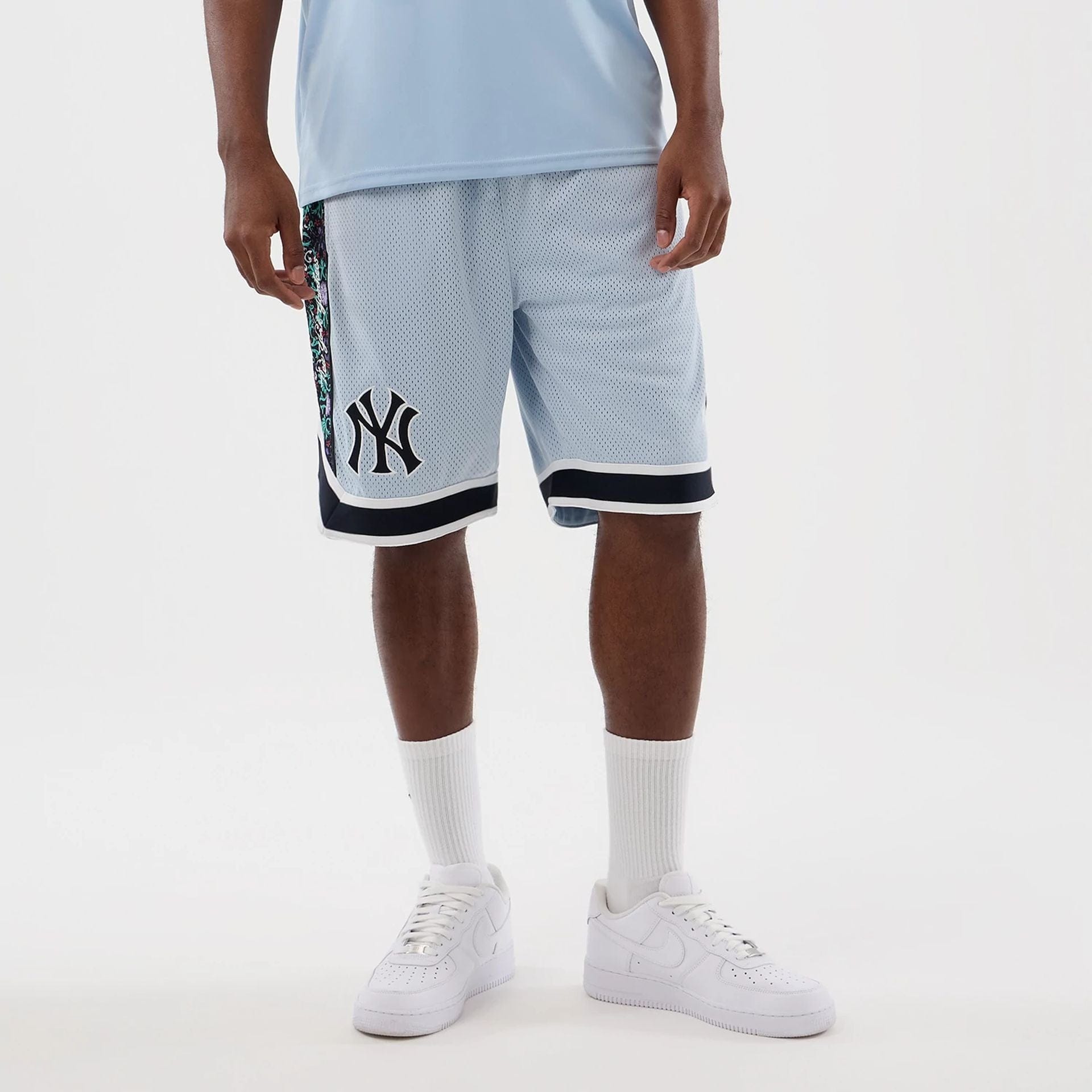 The Male model is wearing New York Yankees MLB Mesh Pastel Blue Mesh Shorts 1