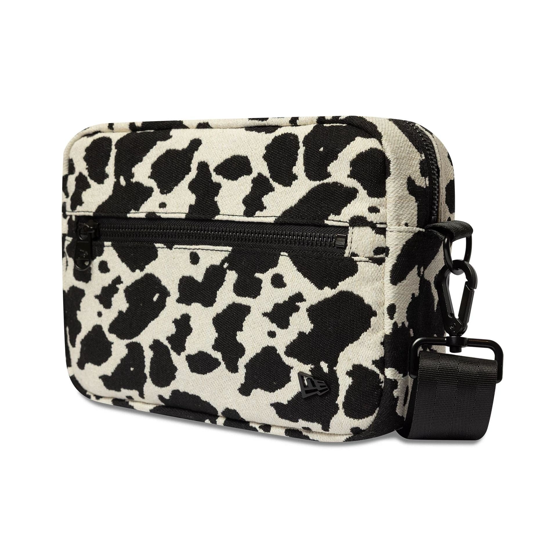 Pictured is this New Era Cow Jacquard Waist Bag in light beige. 1