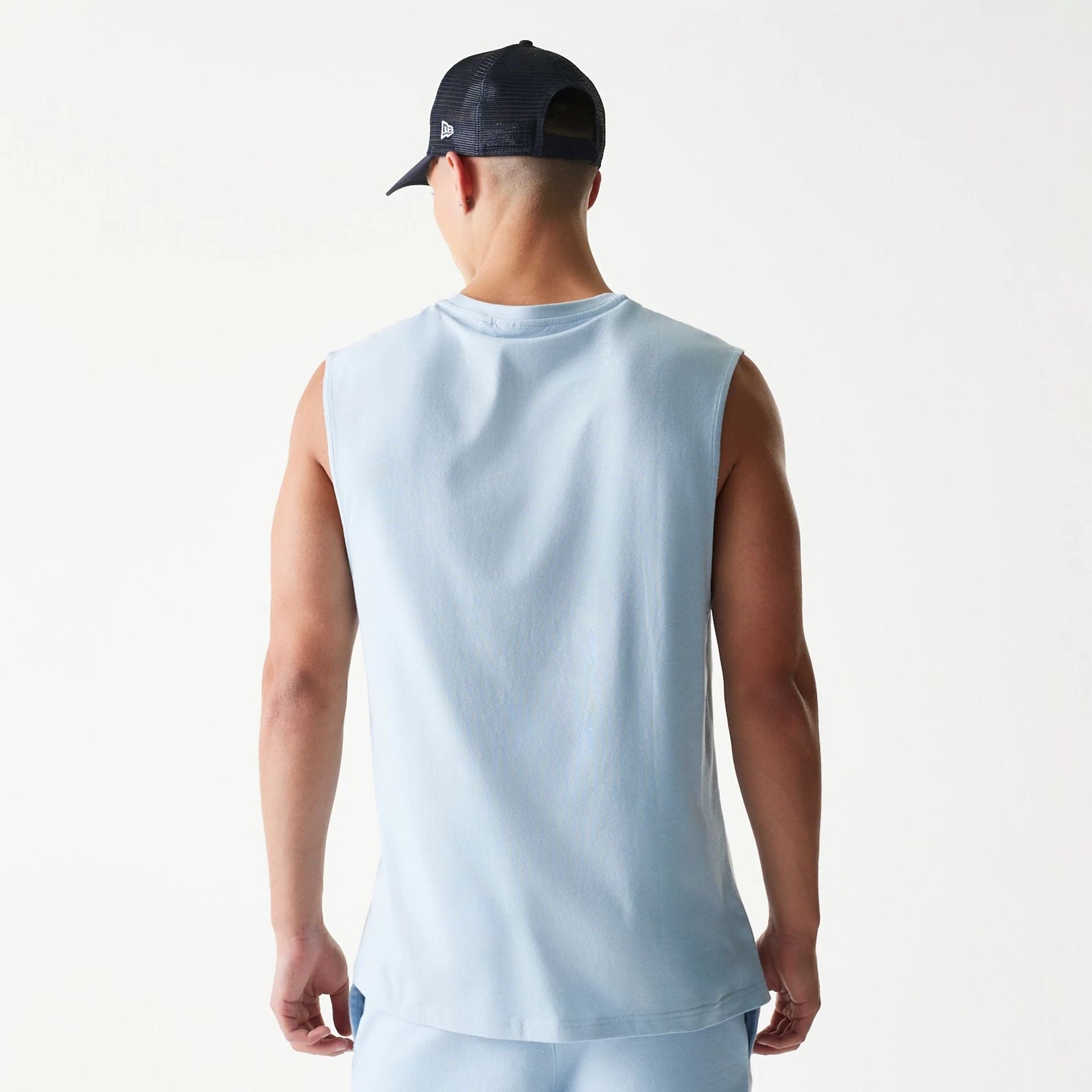 The model is wearing this MLB League Essential New York Yankees Sleeveless T-Shirt in pastel blue. 2