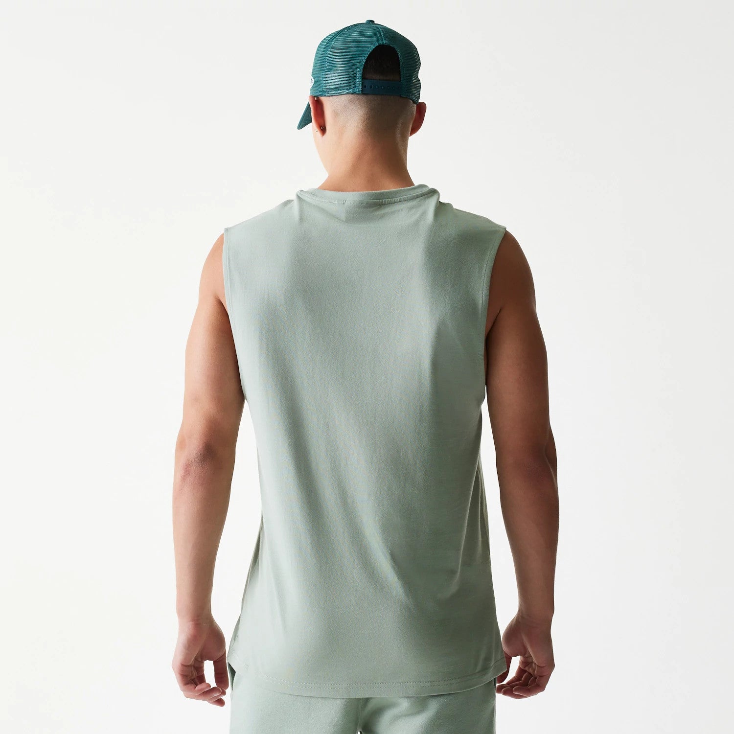 The model is wearing this MLB League Essential LA Dodgers Sleeveless T-Shirt in pastel green. 2