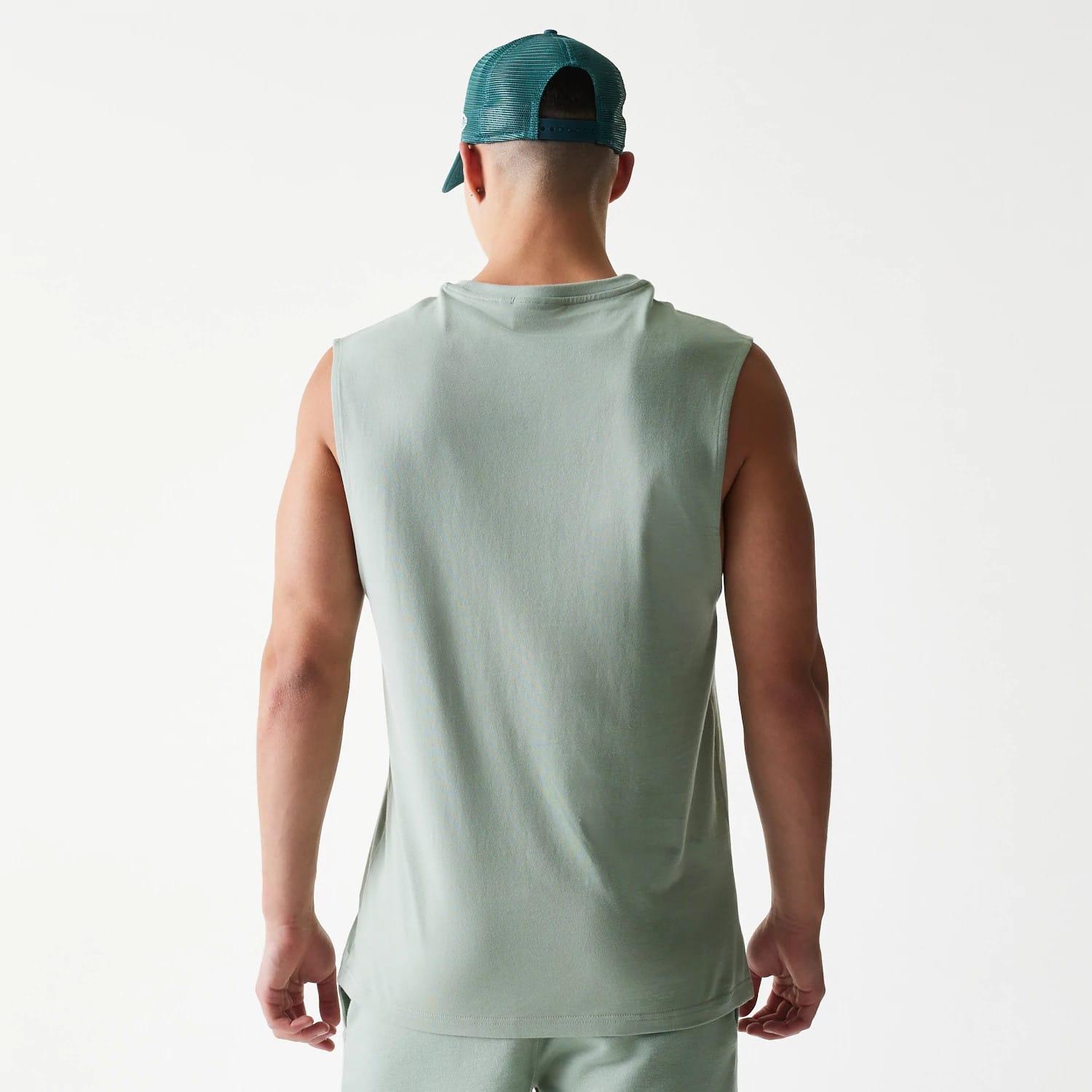 The model is wearing this MLB League Essential LA Dodgers Sleeveless T-Shirt in pastel green. 2