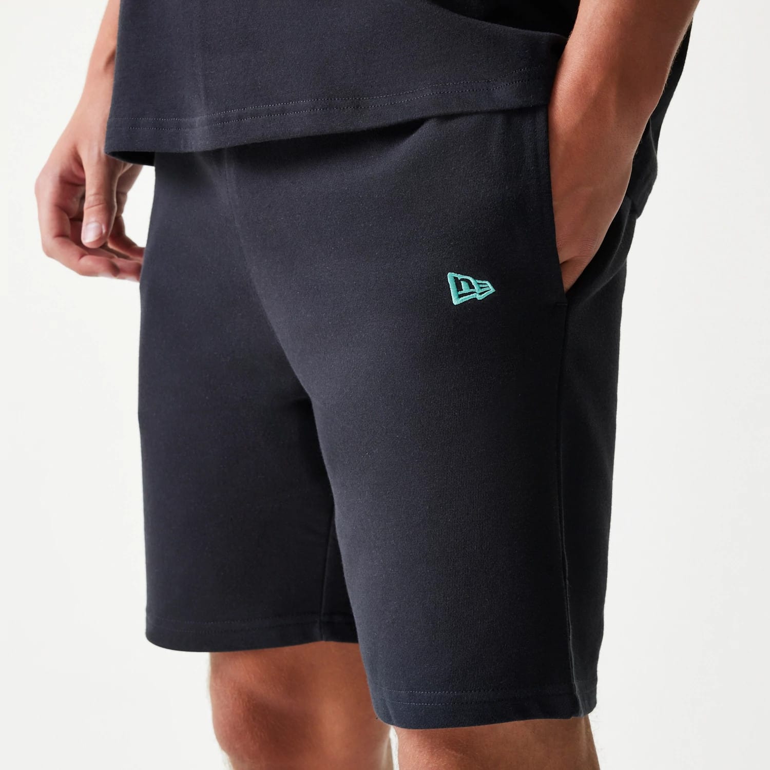 The model is wearing this NBA League Essential Chicago Bulls Shorts in black. 3