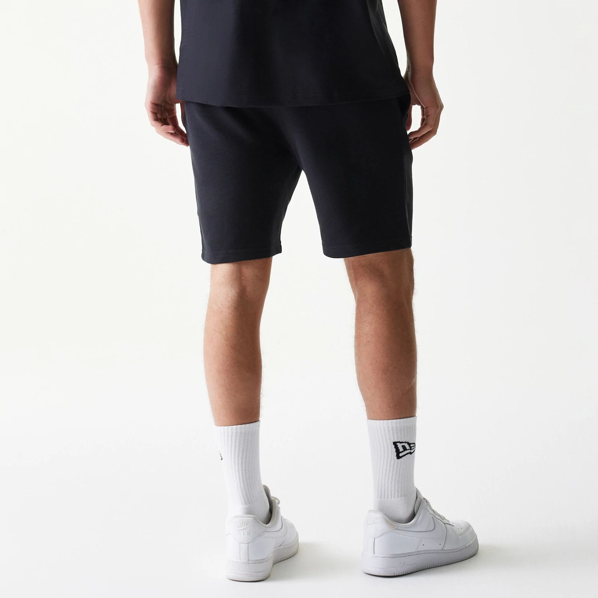 The model is wearing this NBA League Essential Chicago Bulls Shorts in black. 2