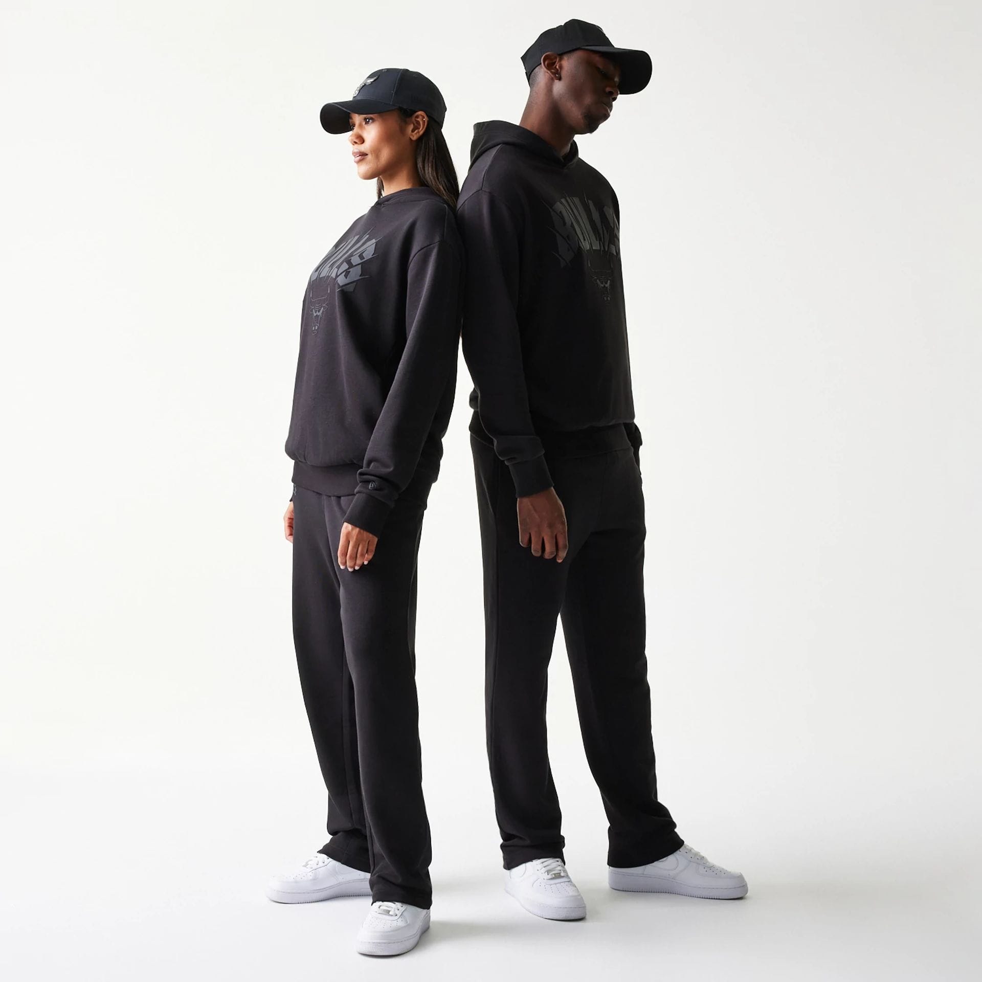 The model is wearing this NBA Chicago Bulls Oversized Pullover Hoodie in black. 1