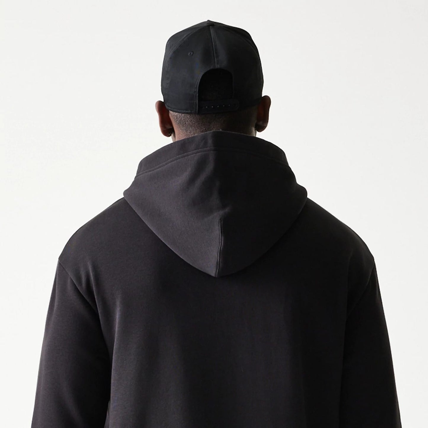 The model is wearing this NBA Chicago Bulls Oversized Pullover Hoodie in black. 8