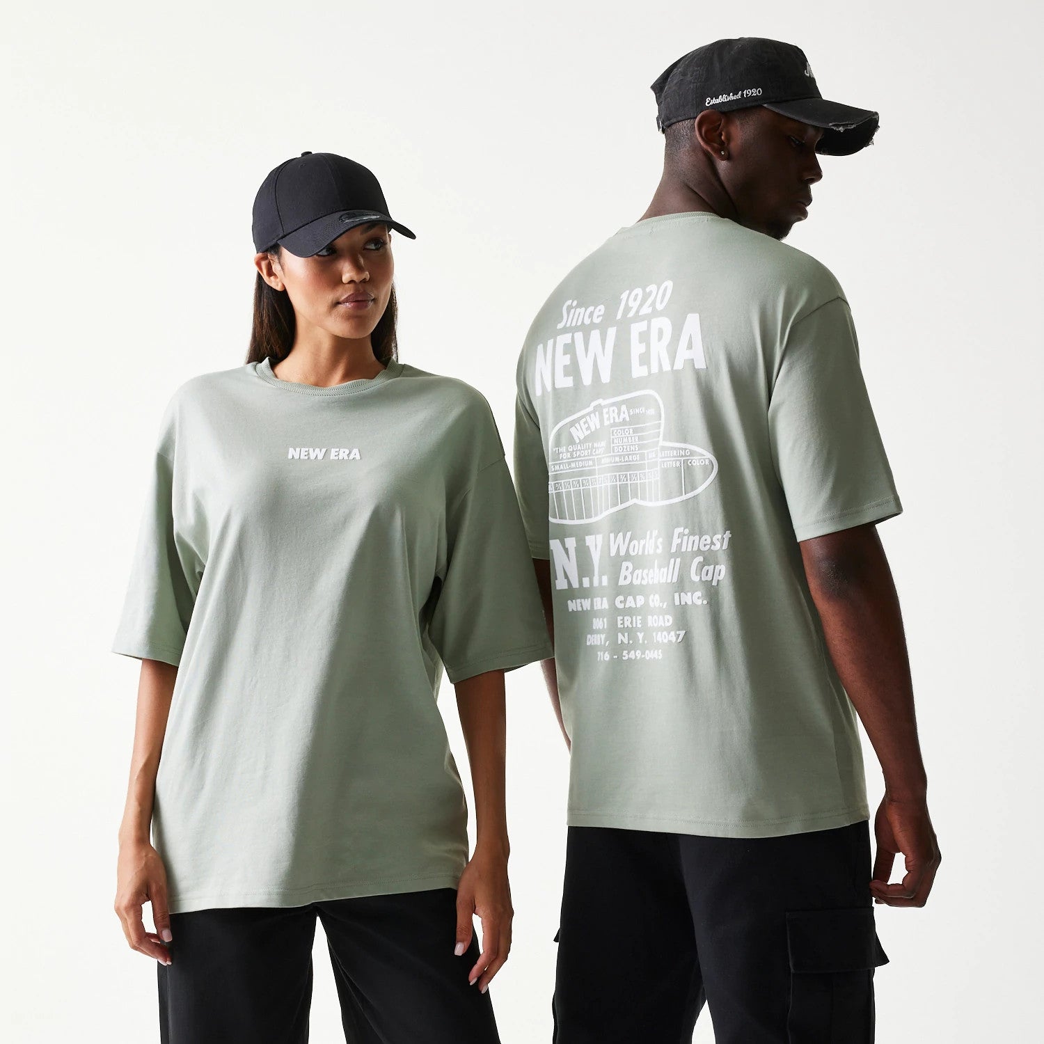 The model is wearing this New Era Graphic Oversized T-Shirt in pastel green. 1