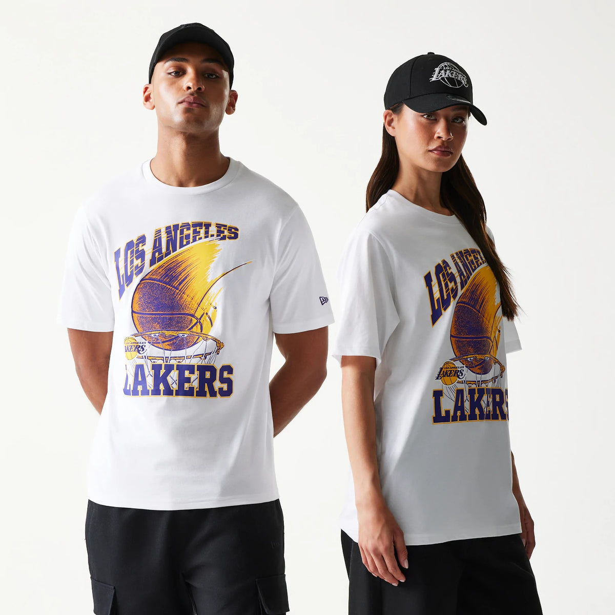 New Era LA Lakers NBA Ball Graphic White T-Shirt, front view on models showcasing a yellow and purple basketball graphic with Los Angeles Lakers text across the chest and an embroidered New Era logo on the left sleeve.