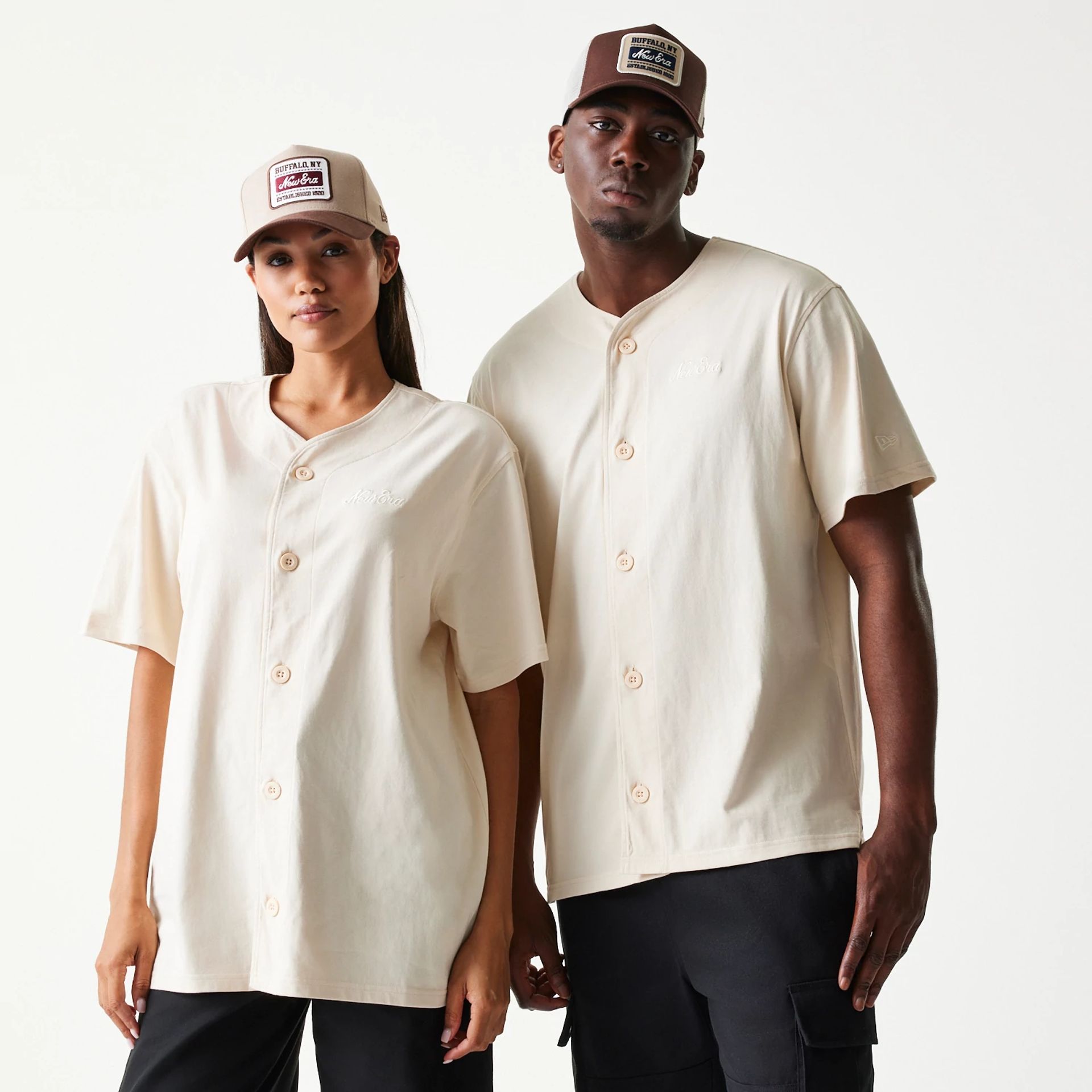 The model is wearing this New Era Script T-Shirt in light beige. 1