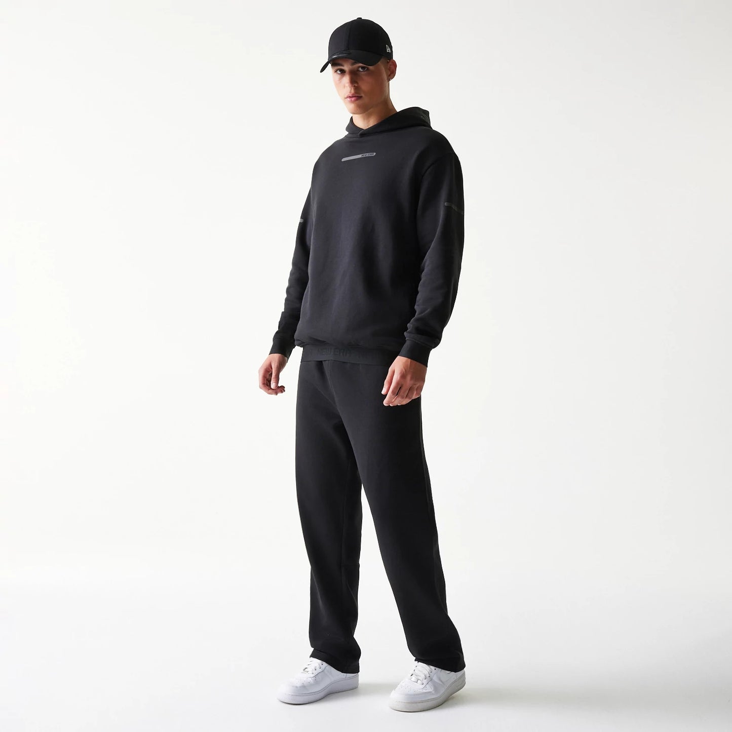The model is wearing this New Era Tech Straight Leg Joggers in black on black. 8