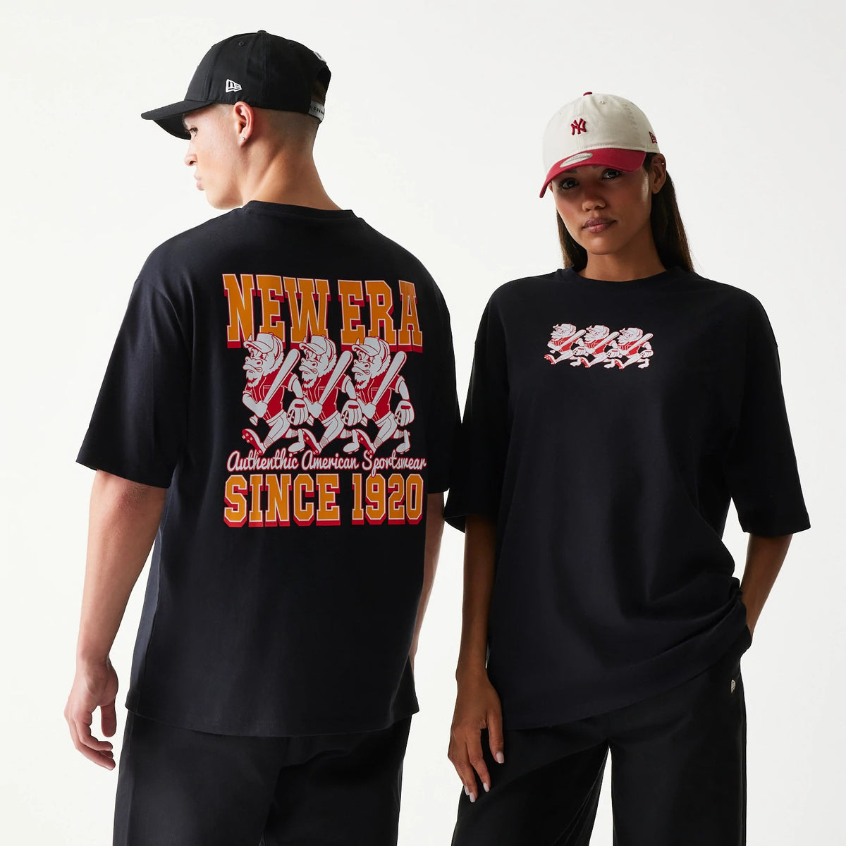 New Era Baseball Cows Character Graphic Black Oversized T-Shirt, front and back view on-model showing a graphic of cartoon cows swinging bats on the chest and back, complemented by yellow New Era lettering and Since 1920 on the back.