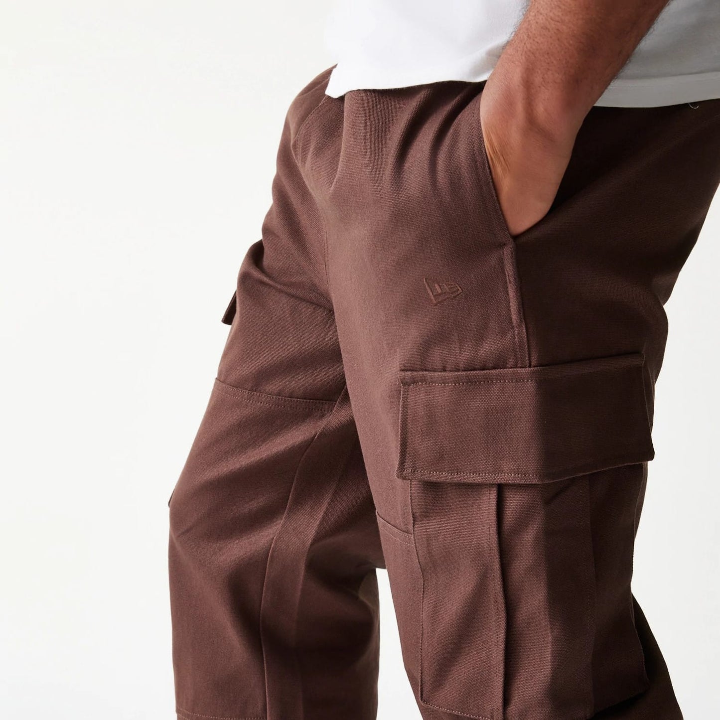 The model is wearing this New Era Straight Leg Cargo Joggers in brown. 8