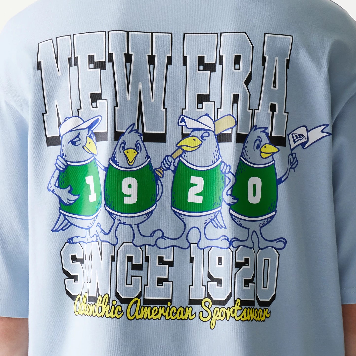 New Era Baseball Birds Character Graphic Blue Oversized T-Shirt, back view showing cartoon birds wearing jerseys with numbers, outlined NEW ERA lettering above, and Since 1920 stylised text below with Athletic American Sportswear caption.