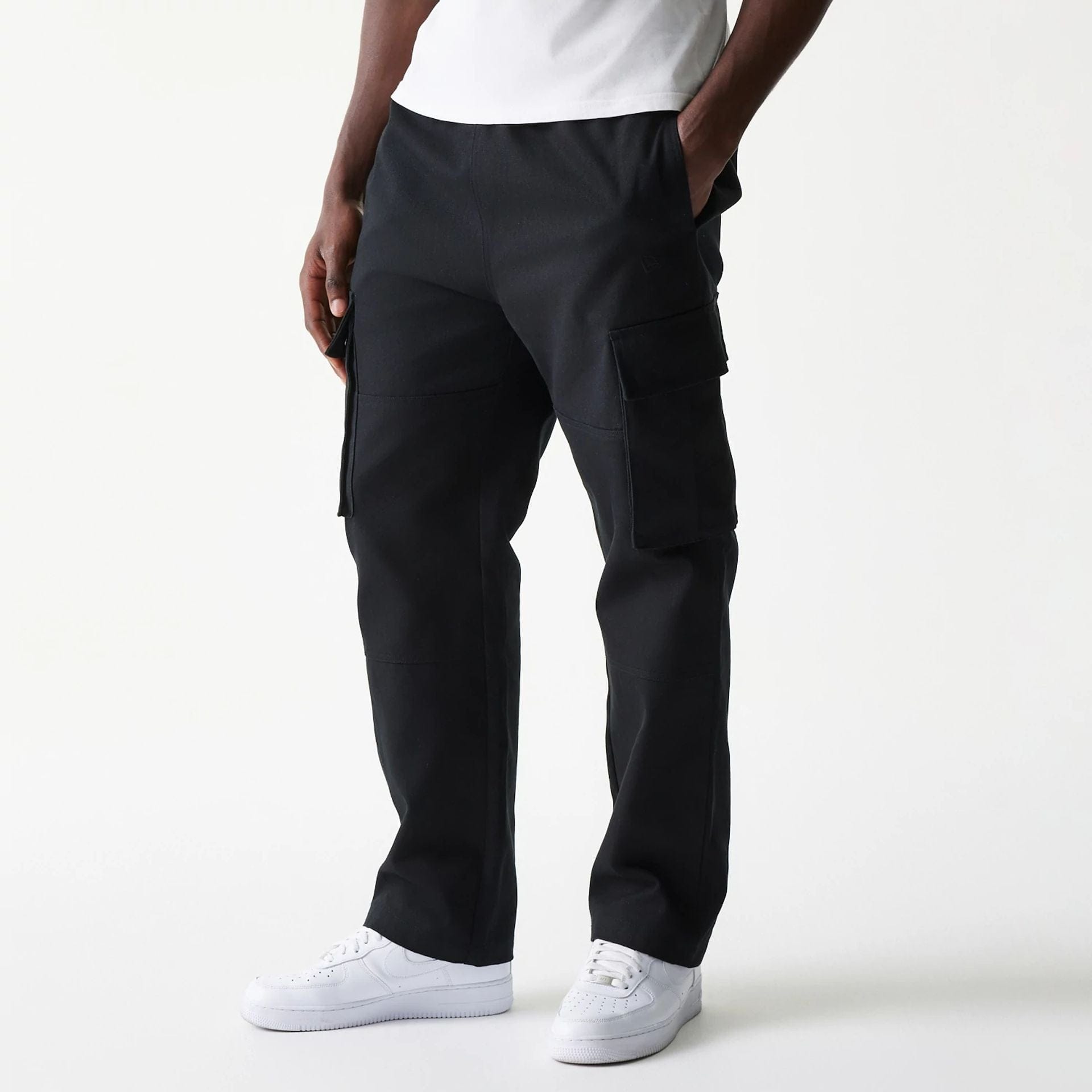 The model is wearing this New Era Straight Leg Cargo Joggers in black. 1