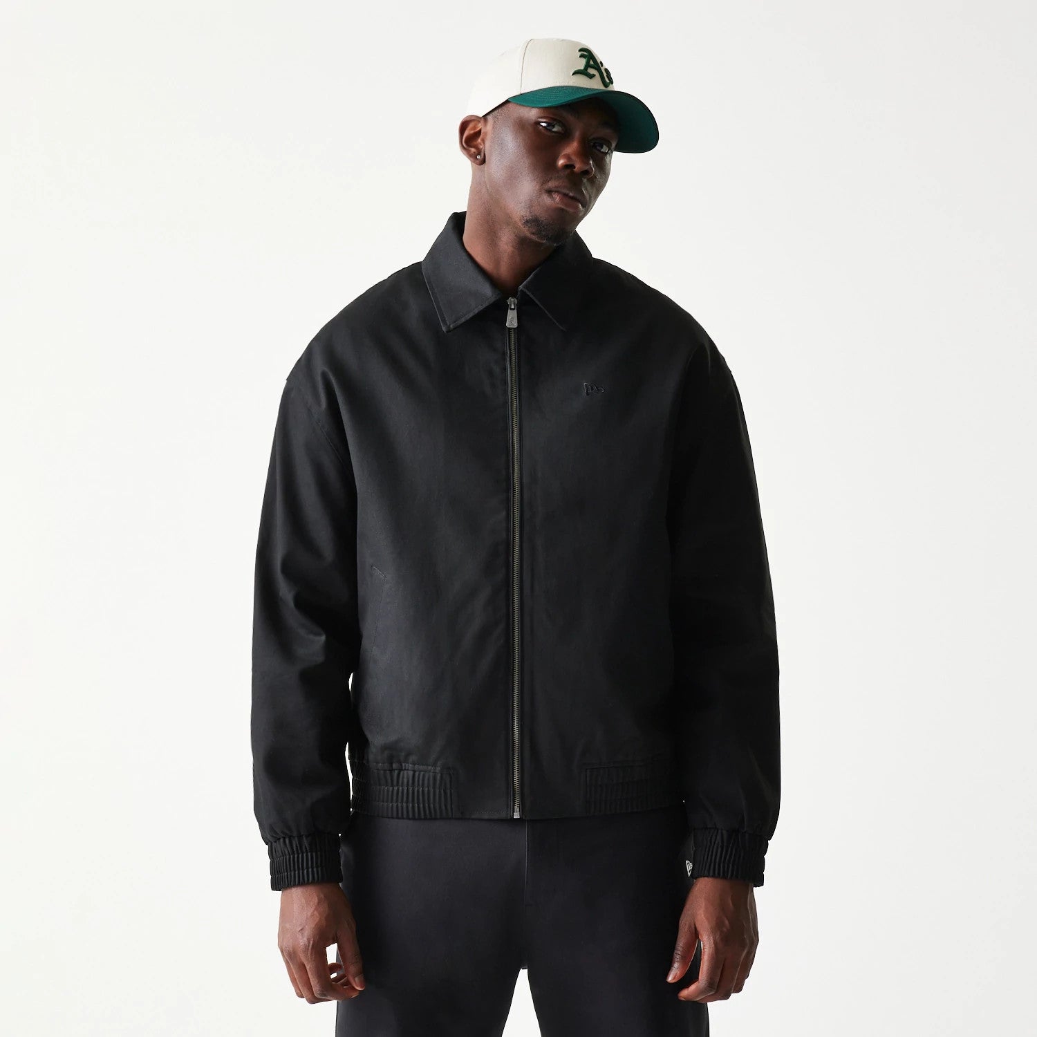 The model is wearing this New Era Collared Jacket in black. 3