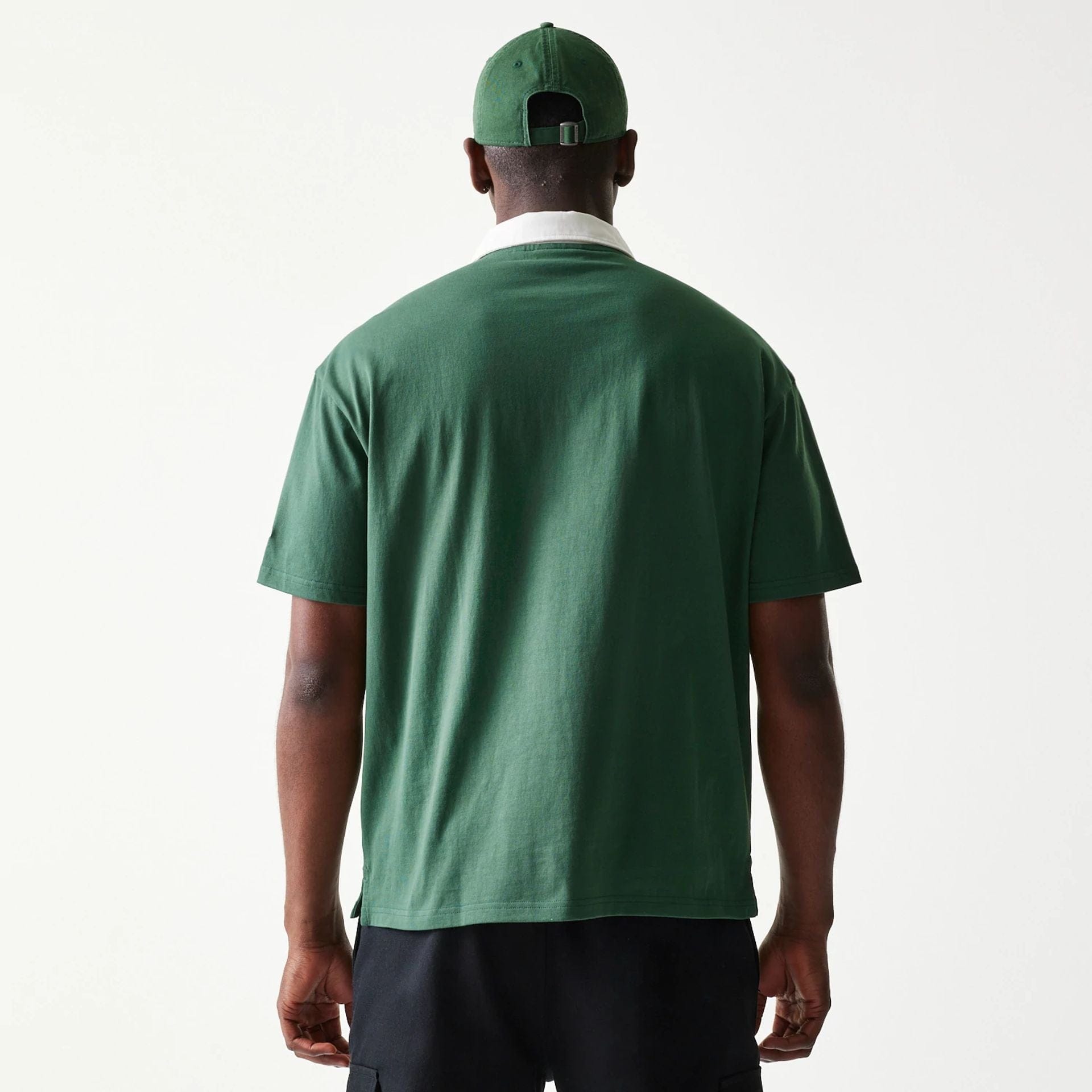 The model is wearing this MLB LA Dodgers Oversized Polo T-Shirt in dark green. 2