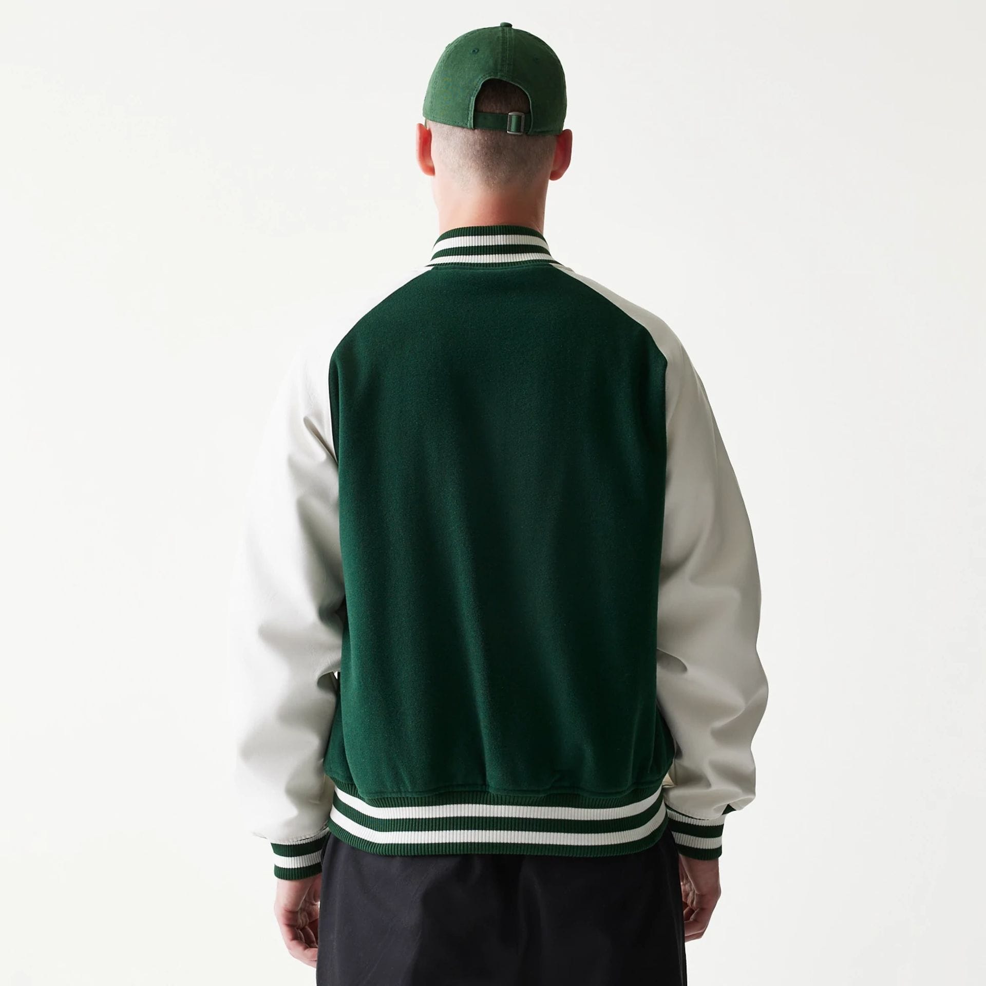 The model is wearing this MLB LA Dodgers Varsity Jacket in dark green. 2