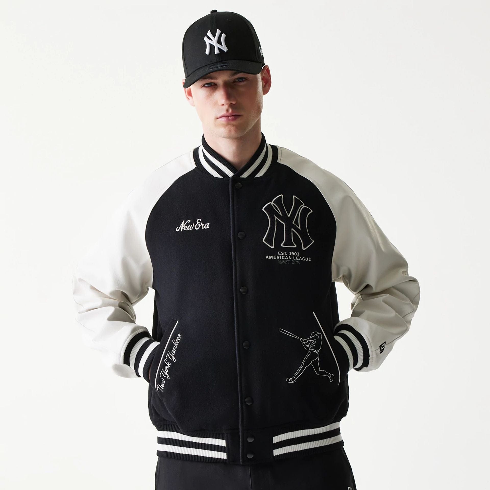 The model is wearing this MLB New York Yankees Varsity Jacket in black. 1