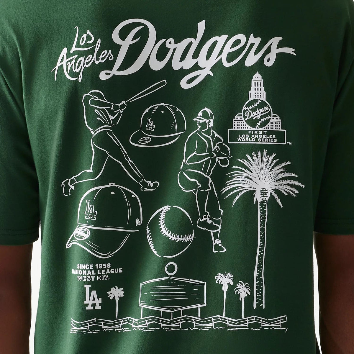 New Era LA Dodgers MLB Baseball Graphic Dark Green Oversized T-Shirt, back view featuring white printed graphics including Dodgers script, baseball players, an LA cap, palm trees, and historic references against the dark green fabric.