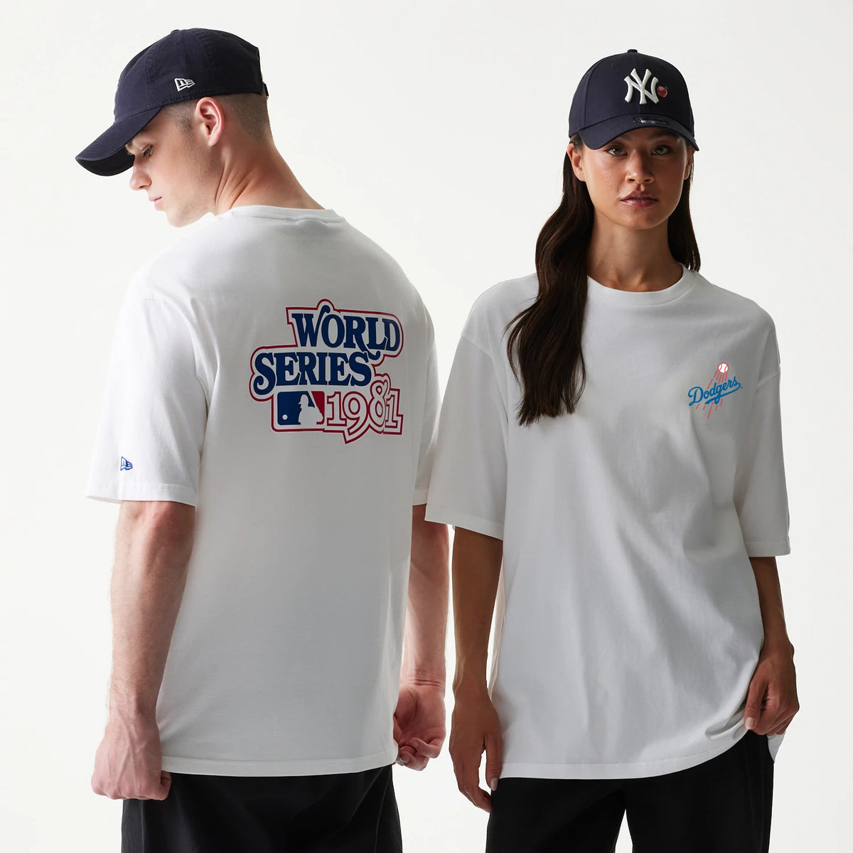 New Era LA Dodgers MLB World Series White T-Shirt, on-model front and back view showing the Dodgers embroidered logo on the chest and large printed World Series 1981 graphic across the upper back, styled with black caps and trousers.