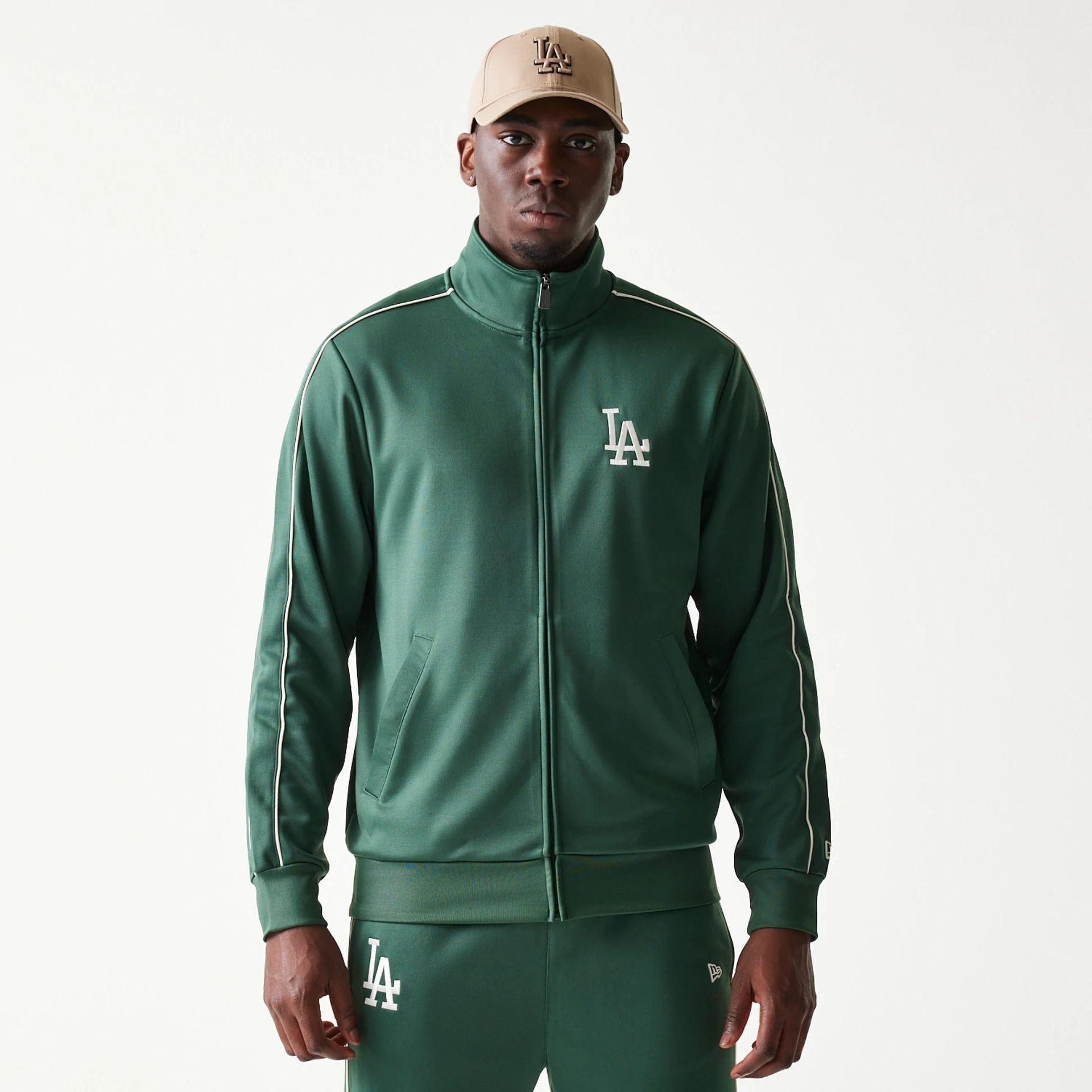 The model is wearing this MLB Piping LA Dodgers Track Jacket in dark green. 1