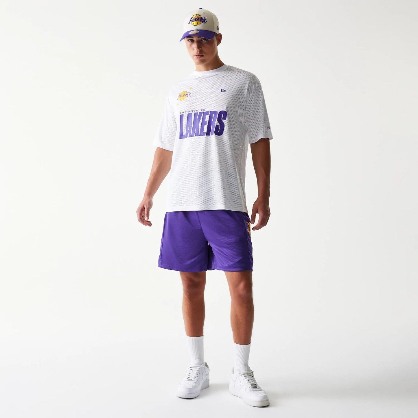 The model is wearing this NBA Mesh LA Lakers Shorts in purple. 8