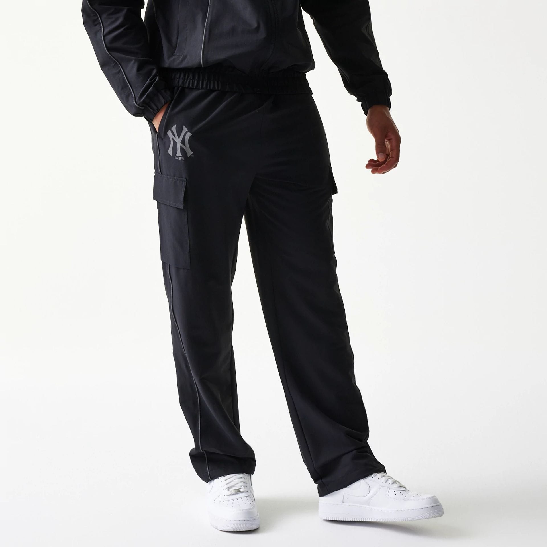 The model is wearing this MLB Utility New York Yankees Straight Leg Cargo Joggers in black. 1