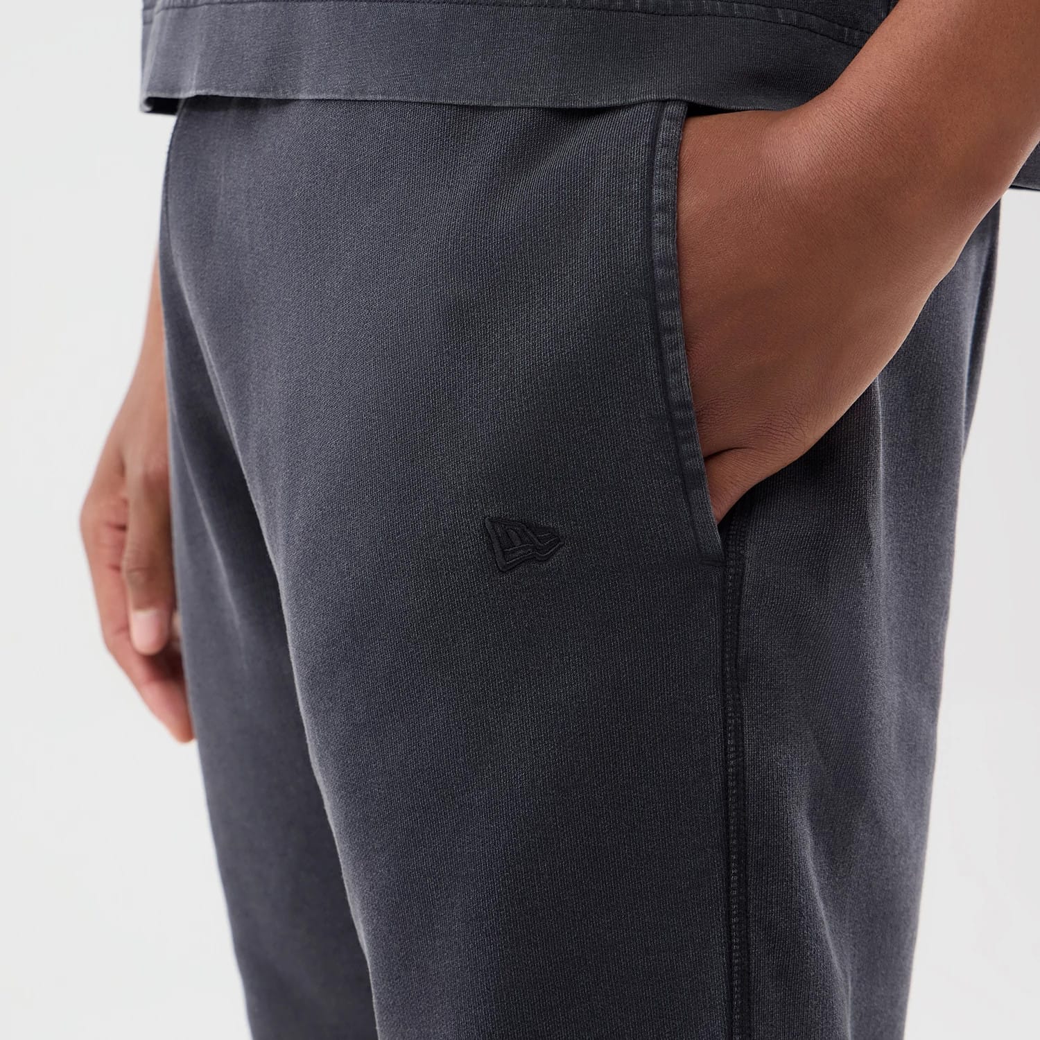 The model is wearing this MLB Washed New York Yankees Shorts in black. 4