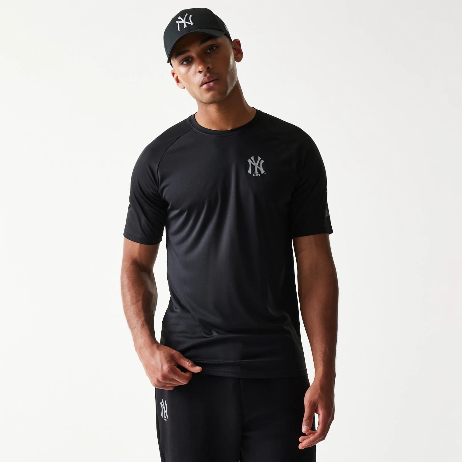 The model is wearing this MLB New York Yankees Reflective T-Shirt in black. 1