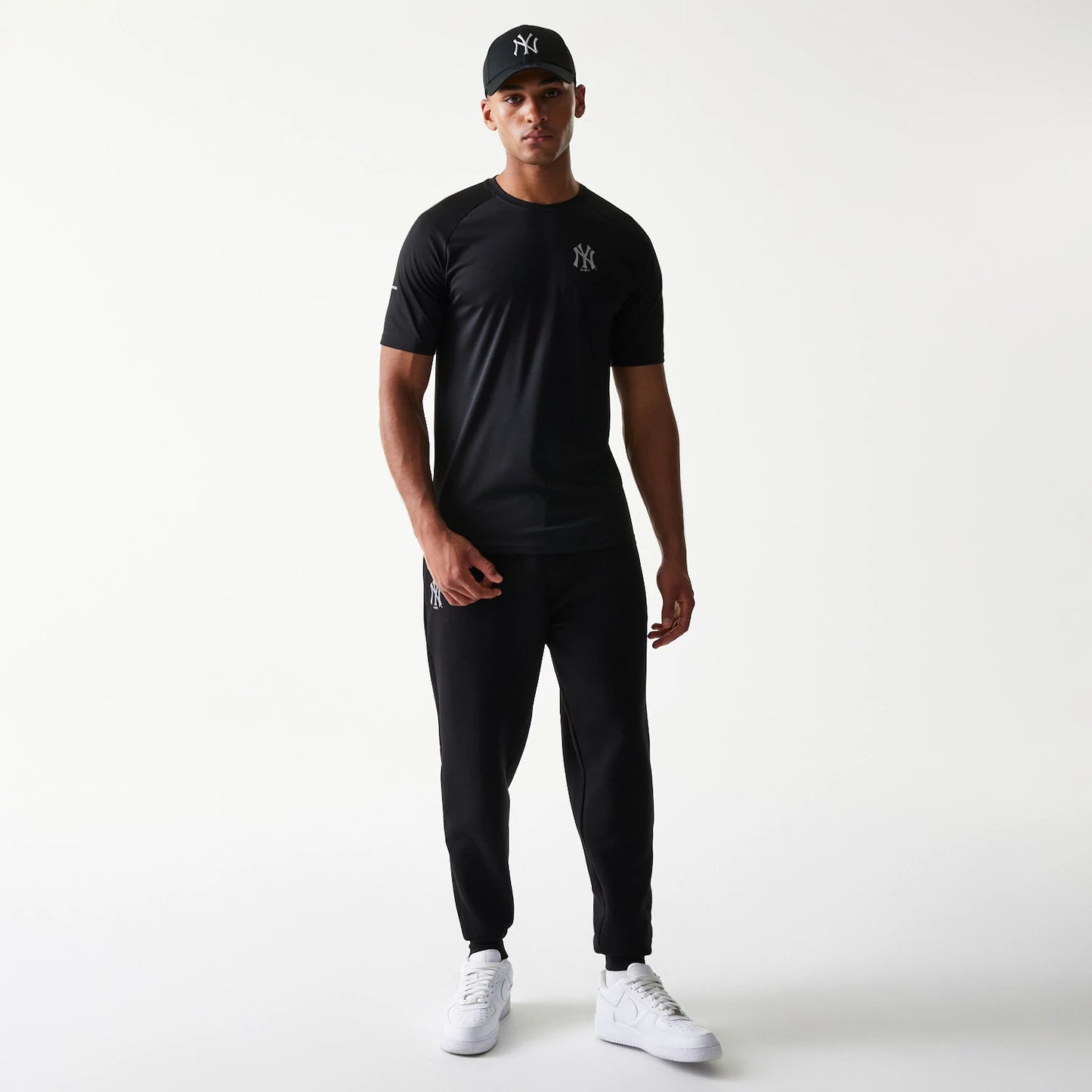 The model is wearing this MLB New York Yankees Reflective T-Shirt in black. 8
