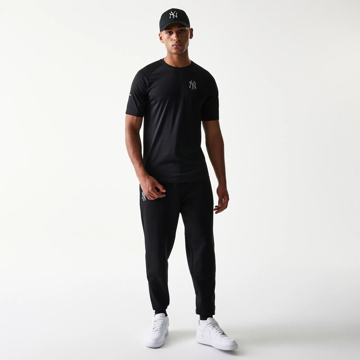 The model is wearing this MLB New York Yankees Reflective T-Shirt in black. 8
