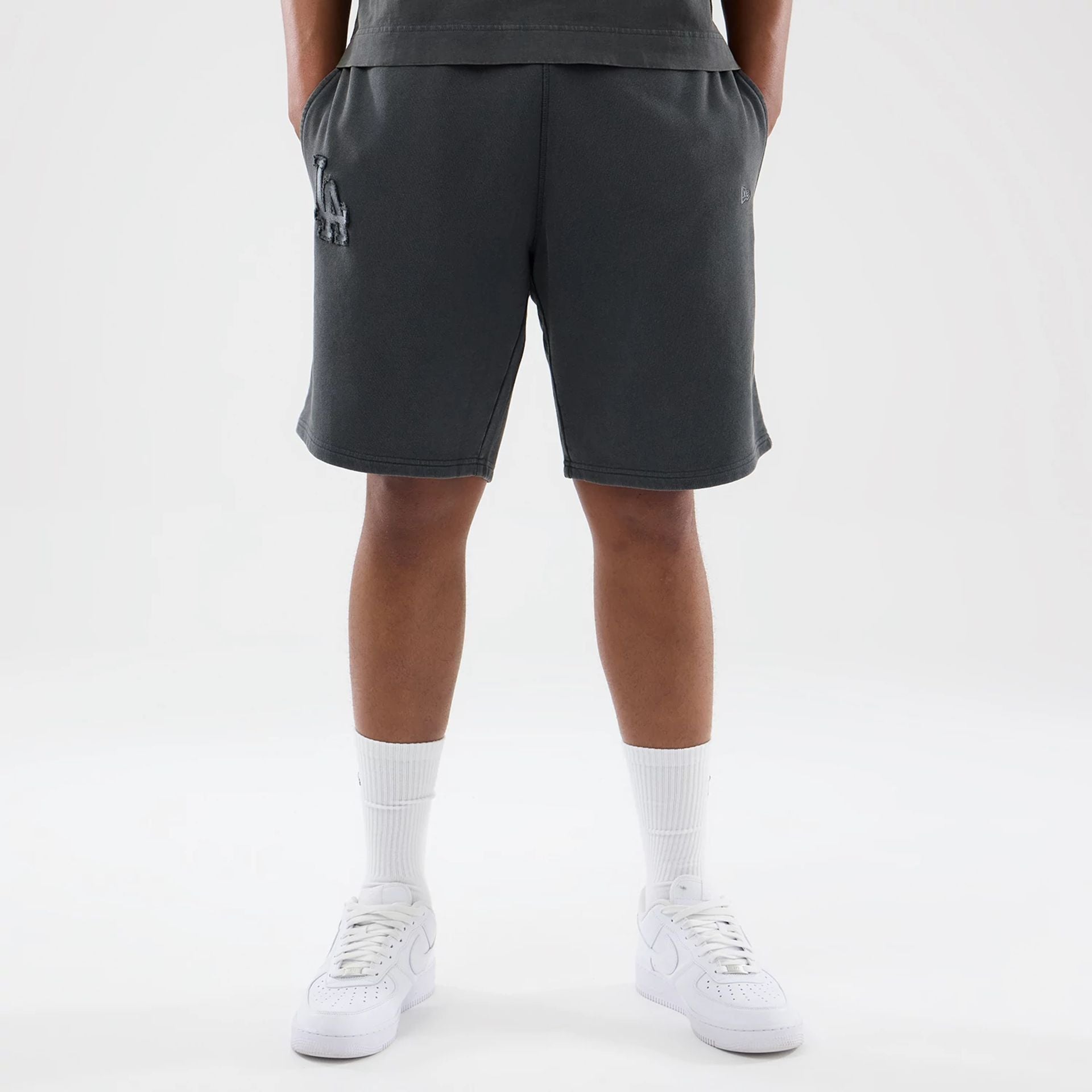 The model is wearing this MLB Washed LA Dodgers Shorts in Dark Grey. 1