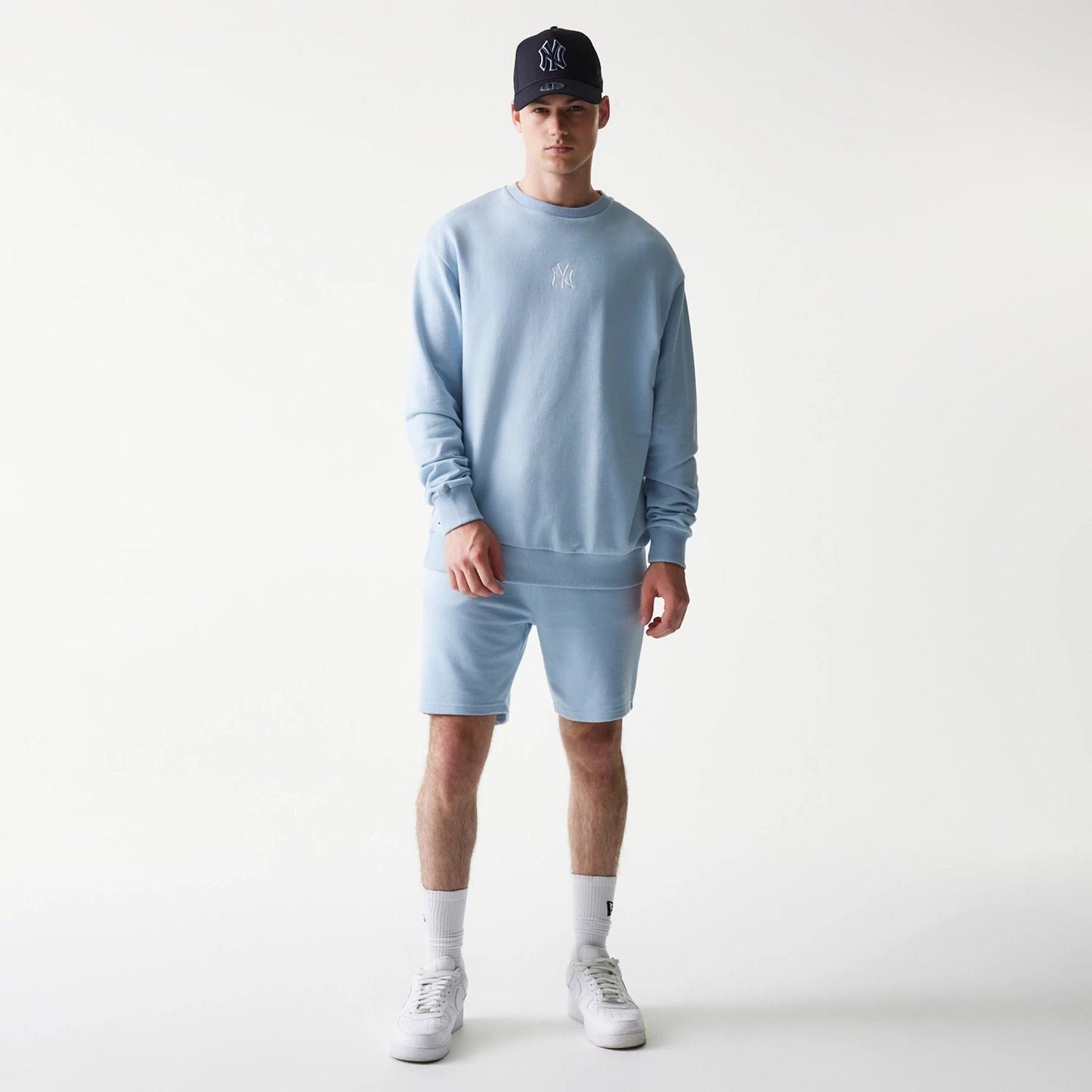 The model is wearing this MLB League Essential Midi New York Yankees Oversized Crew Neck Sweater in pastel blue. 8