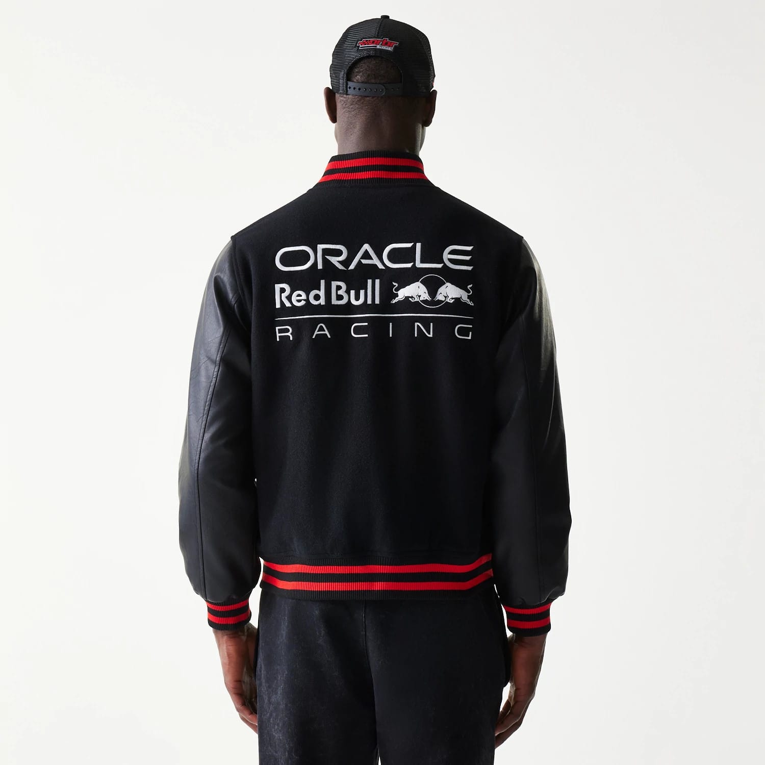 The model is wearing this Red Bull Racing Varsity Jacket in black. 2