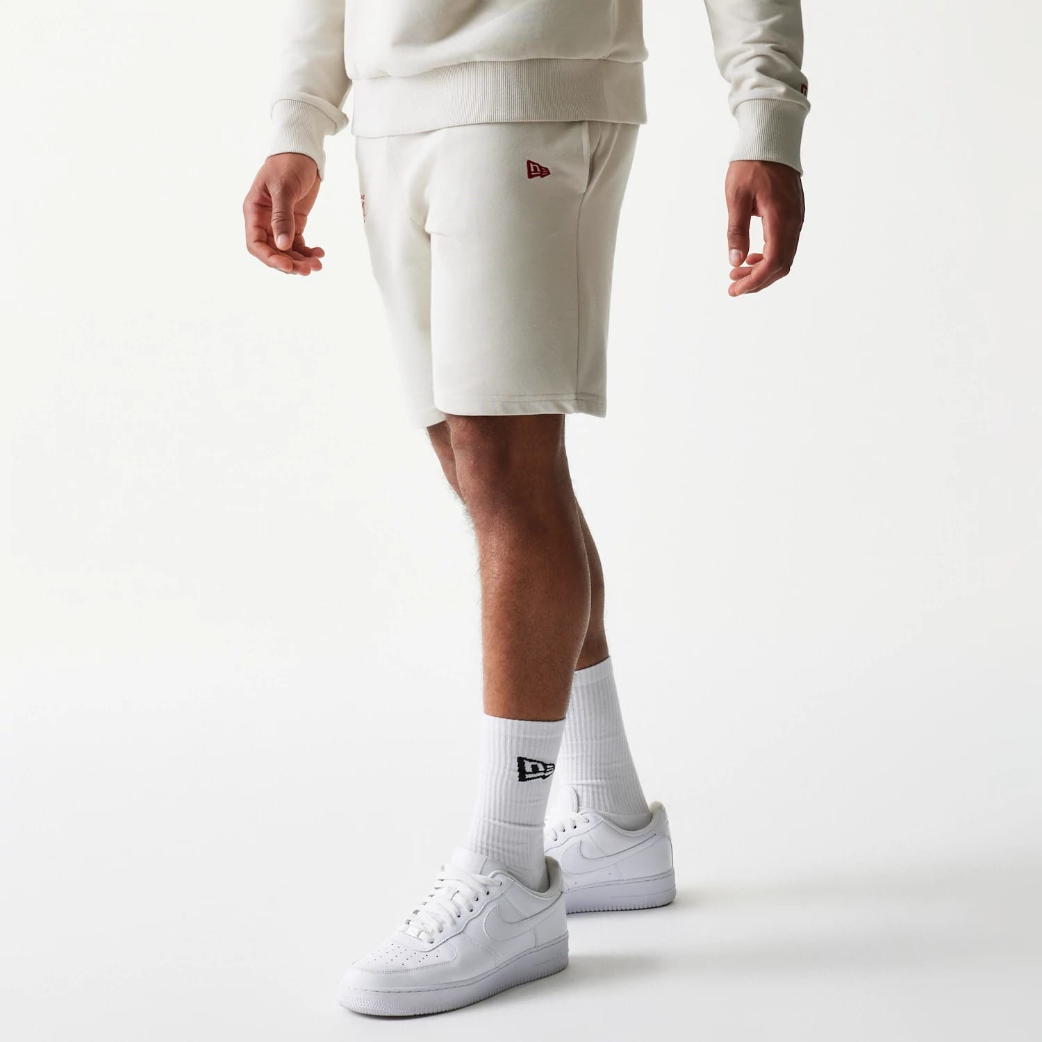 The model is wearing this NBA League Essential LA Lakers Shorts in light beige. 1