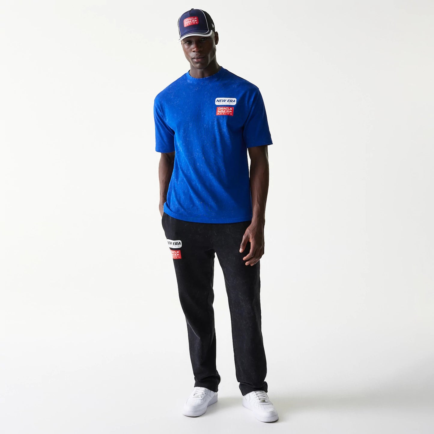 The model is wearing this Red Bull Racing Linear Graphic Oversized T-Shirt in blue. 8