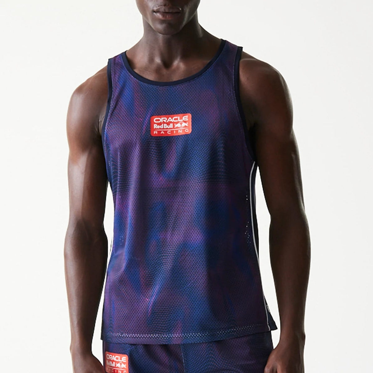 The model is wearing this Red Bull Racing Mesh Tank Top in dark blue. 3