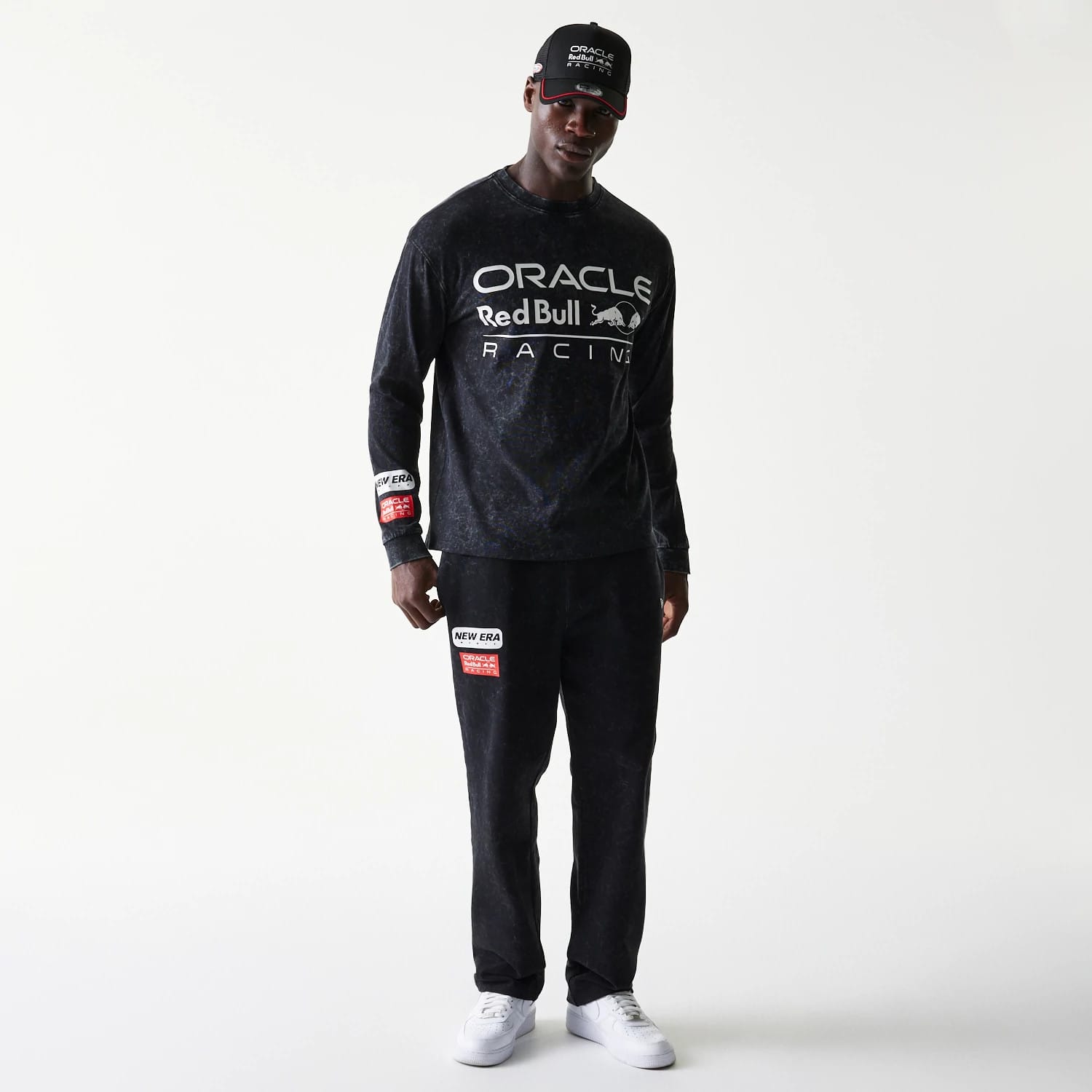 The model is wearing this Red Bull Racing Linear Graphic Long Sleeve T-Shirt in black. 8